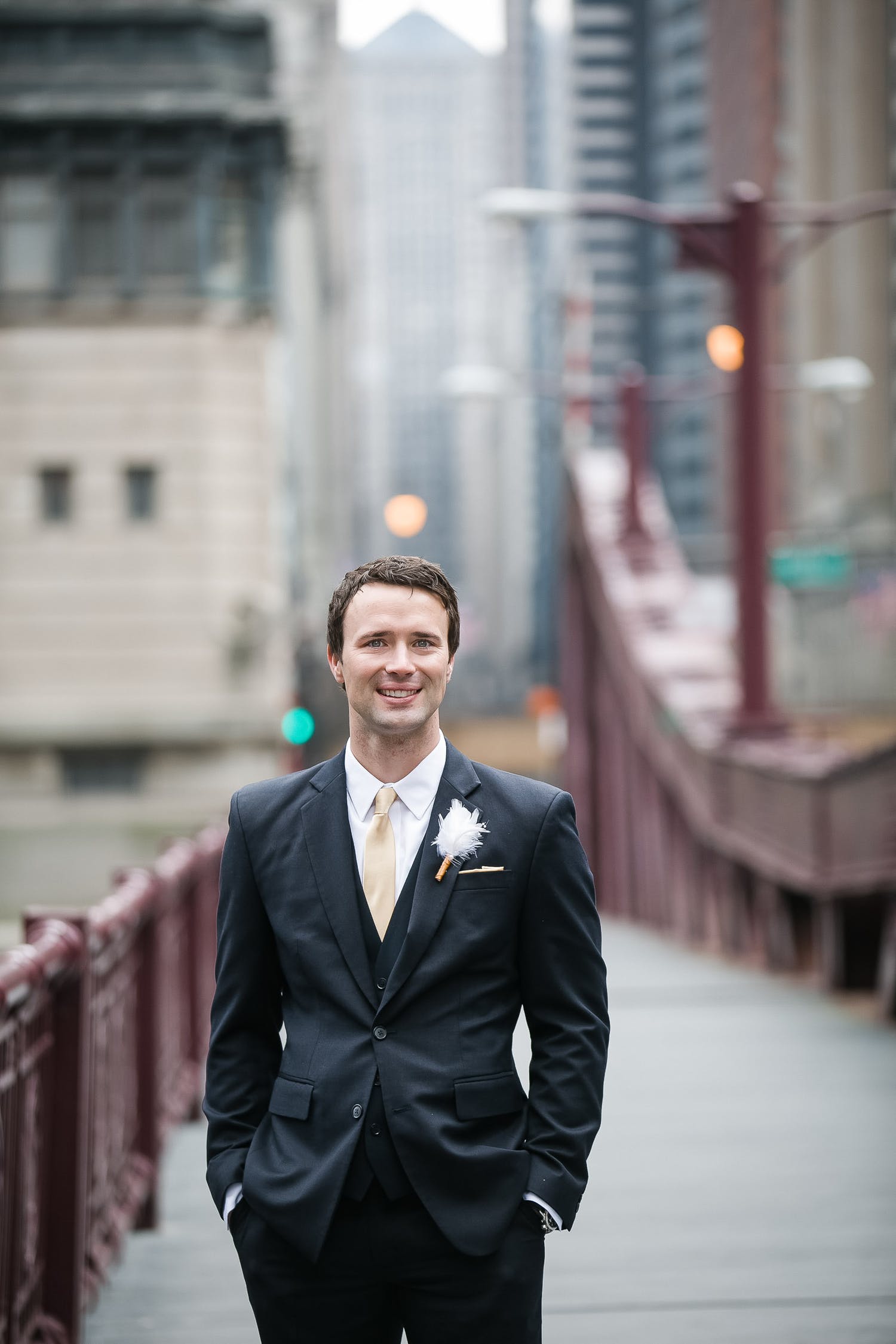 White feather wedding boutonniere | PartySlate