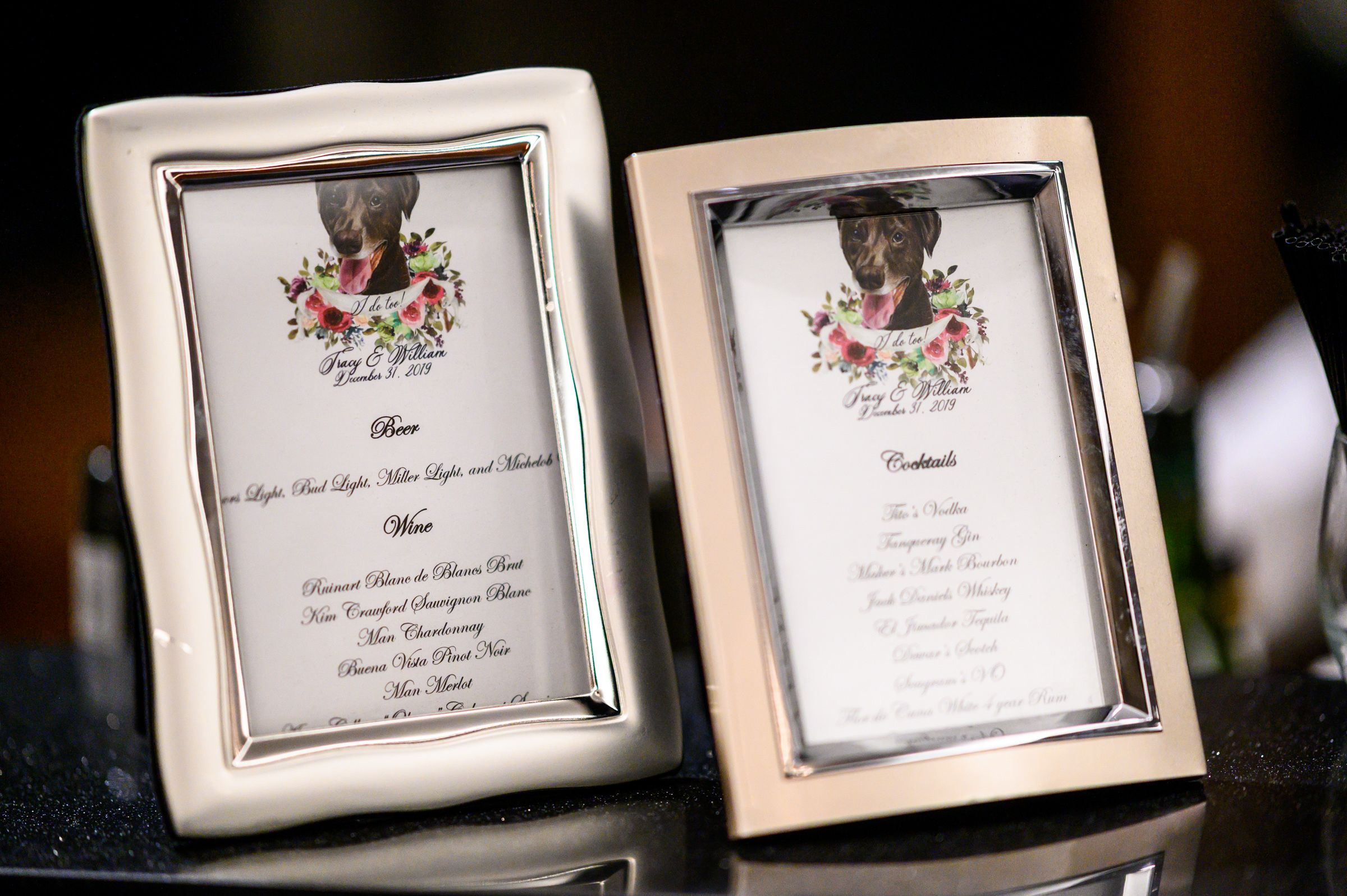 two framed wedding cocktail menus with dog drawings | PartySlate