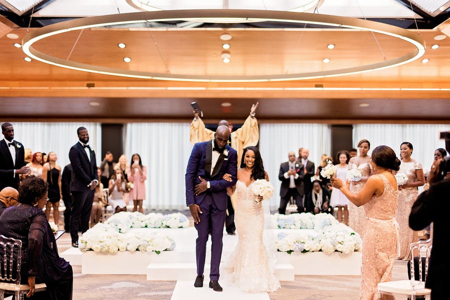 Dallas Wedding Ceremony at Westin Dallas Downtown with Gold Accents and White Flowers | PartySlate