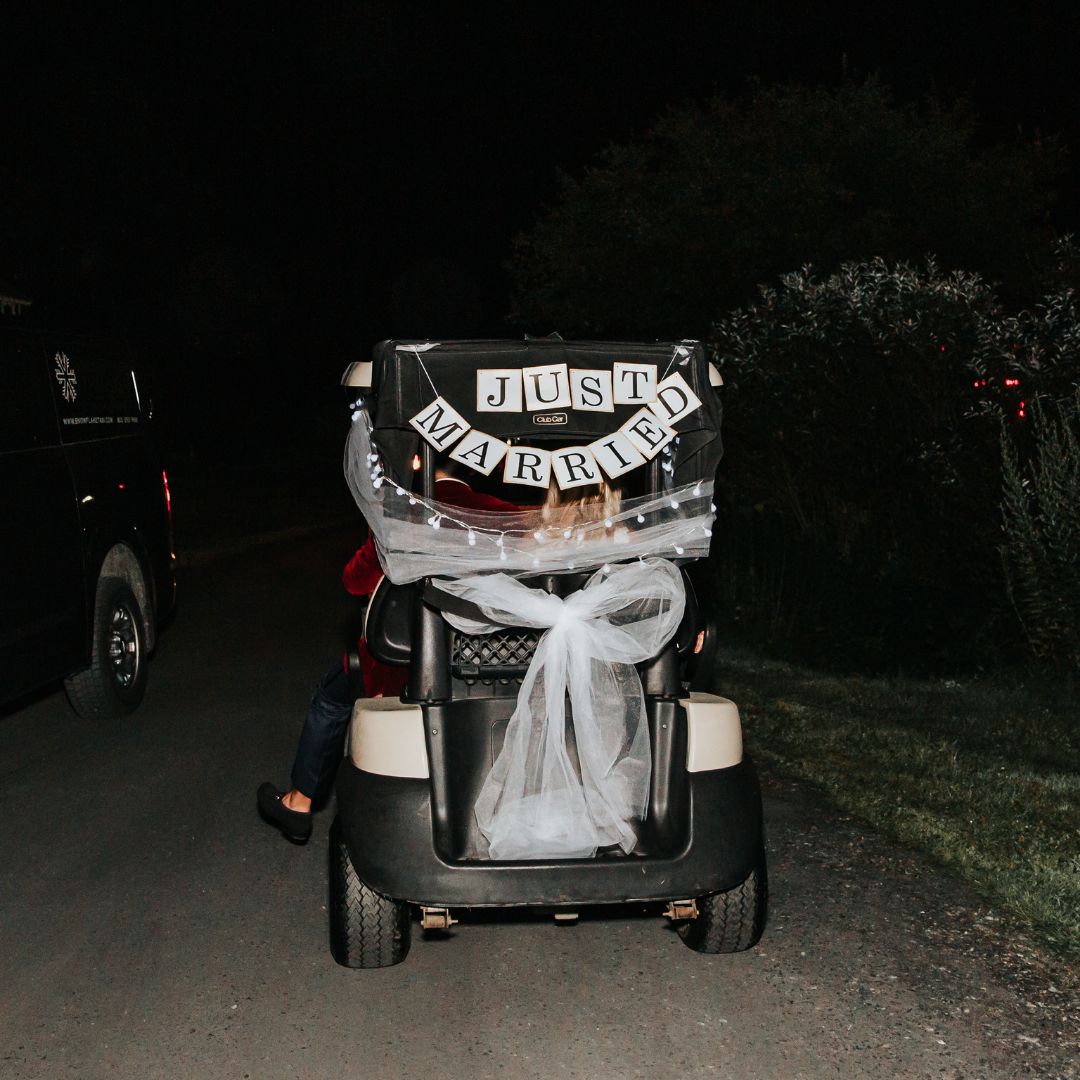 Romantic Summer Wedding at Topnotch Resort in Stowe, VT With Creative Wedding Exit and Couple Leaving Venue in a Golf Cart | PartySlate