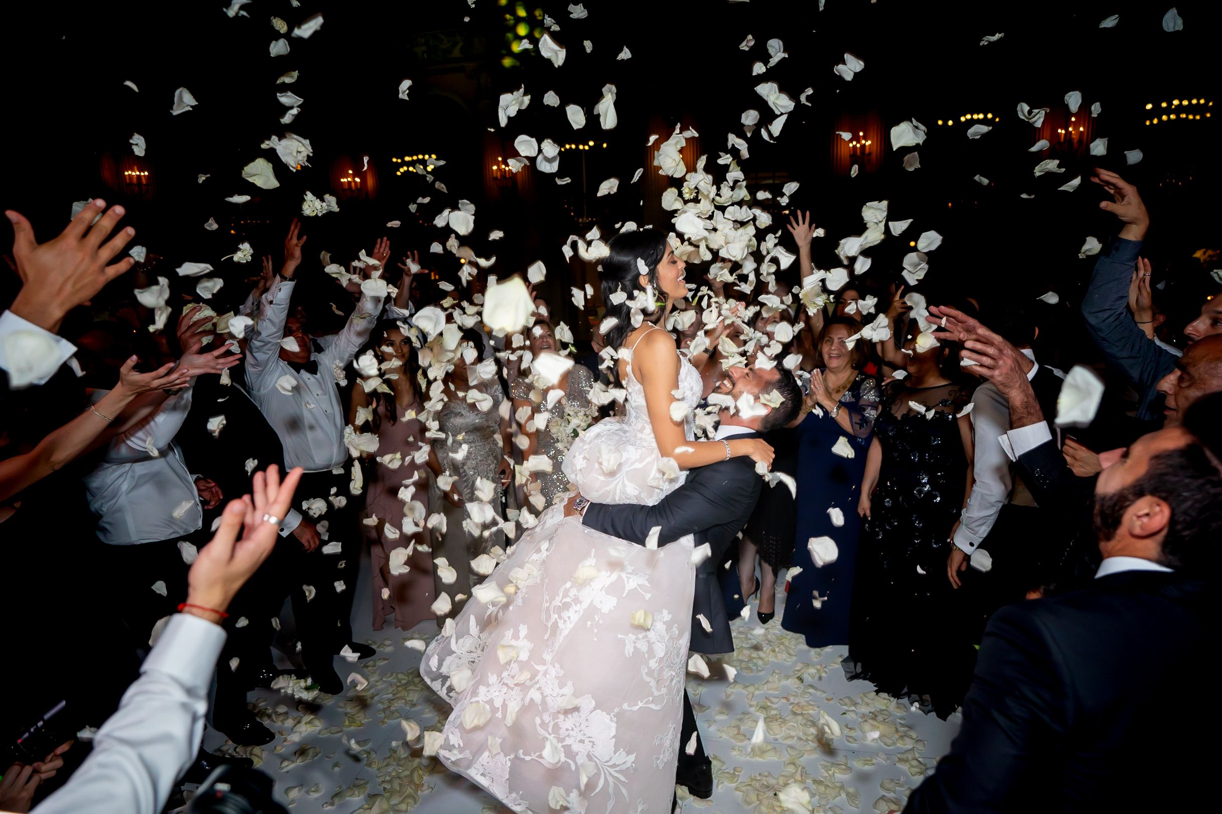 Luxurious Downtown Wedding in Los Angeles, CA With Rose Petals Being Thrown As Couple Leaves Church Wedding | PartySlate