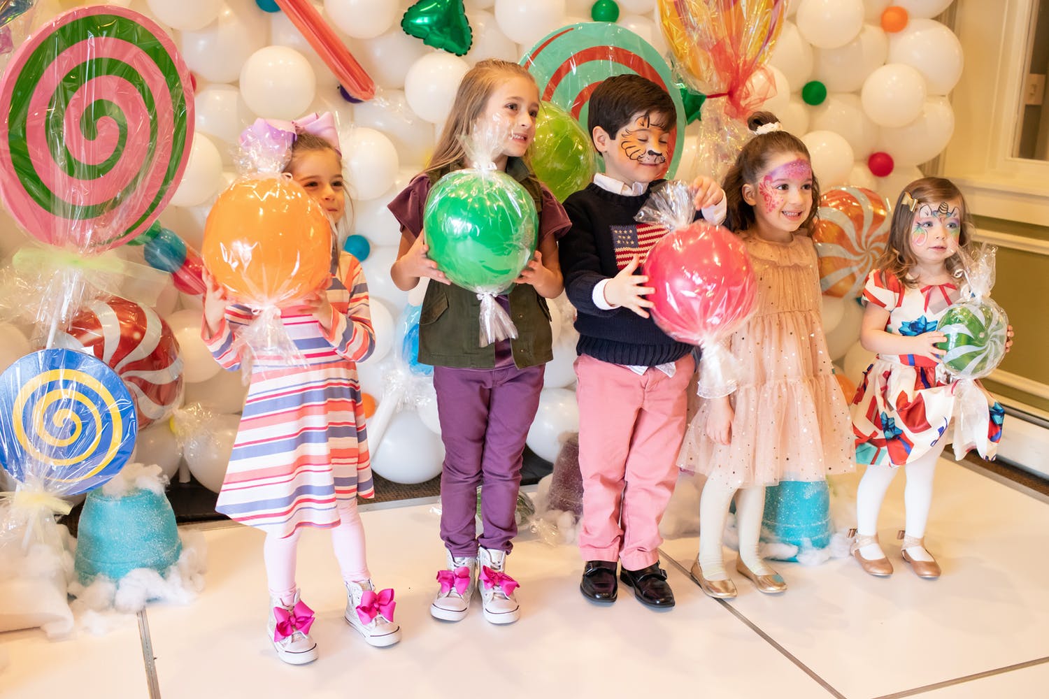 Colorful Candyland kid's birthday party with candy photo props | PartySlate