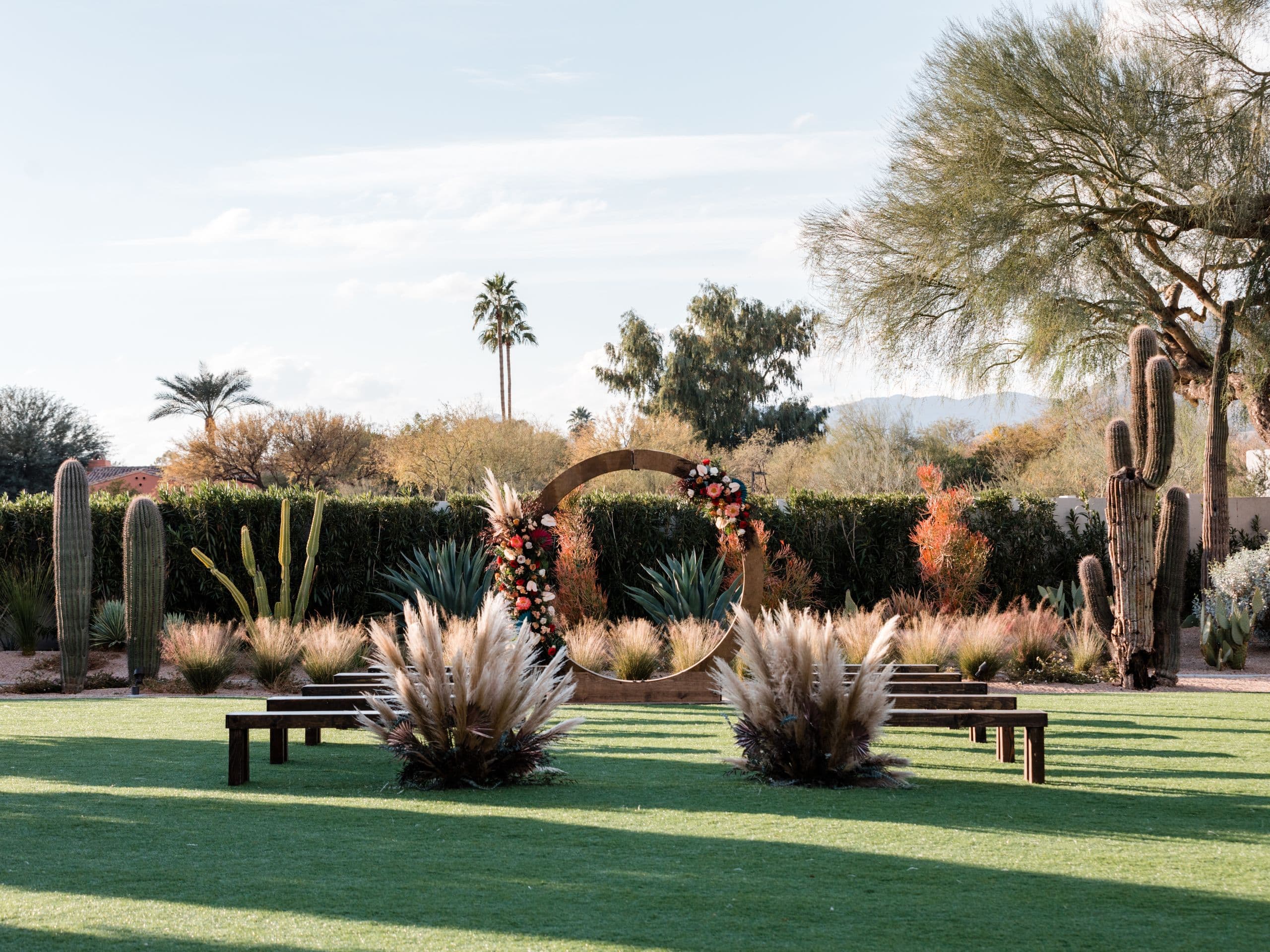 Wedding Décor and Aisle with Floral Arch Outside in Scottsdale Arizona | PartySlate