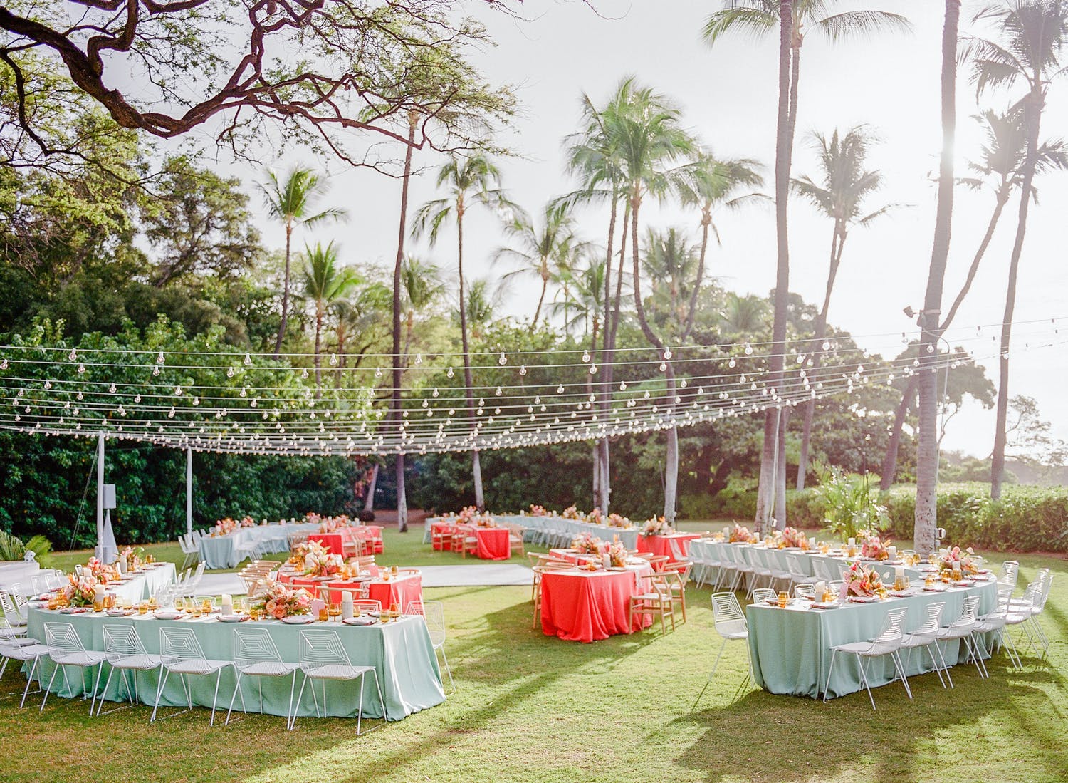 Wedding reception in beach wedding colors of light blue and hot pink | PartySlate