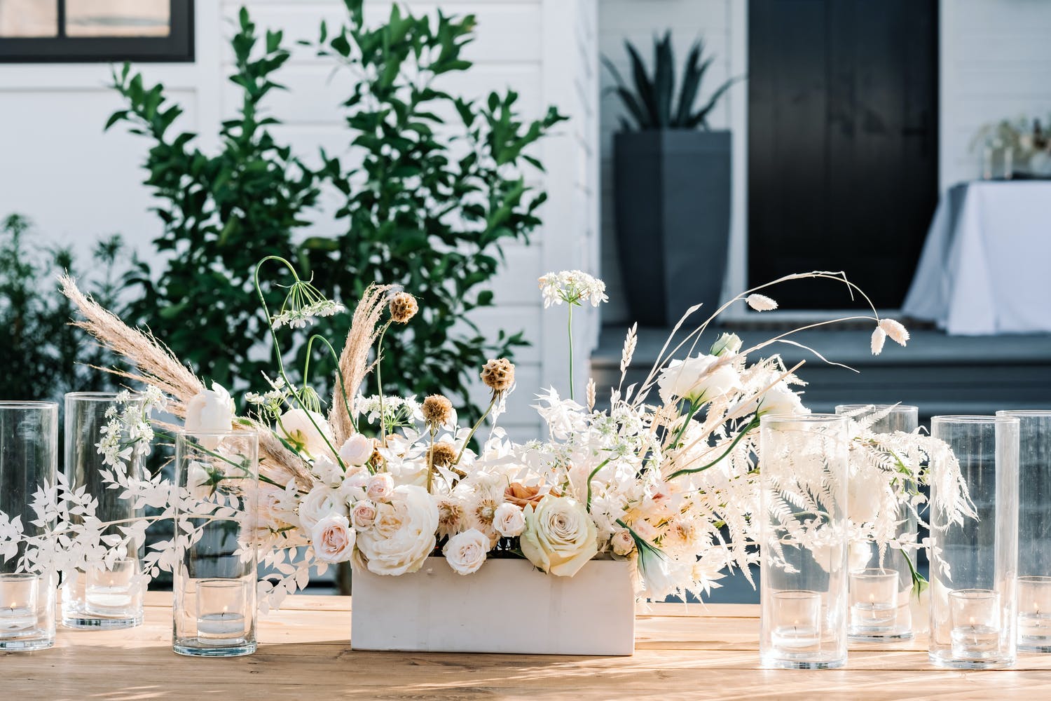 Boho beach wedding centerpiece in neutral hues | PartySlate
