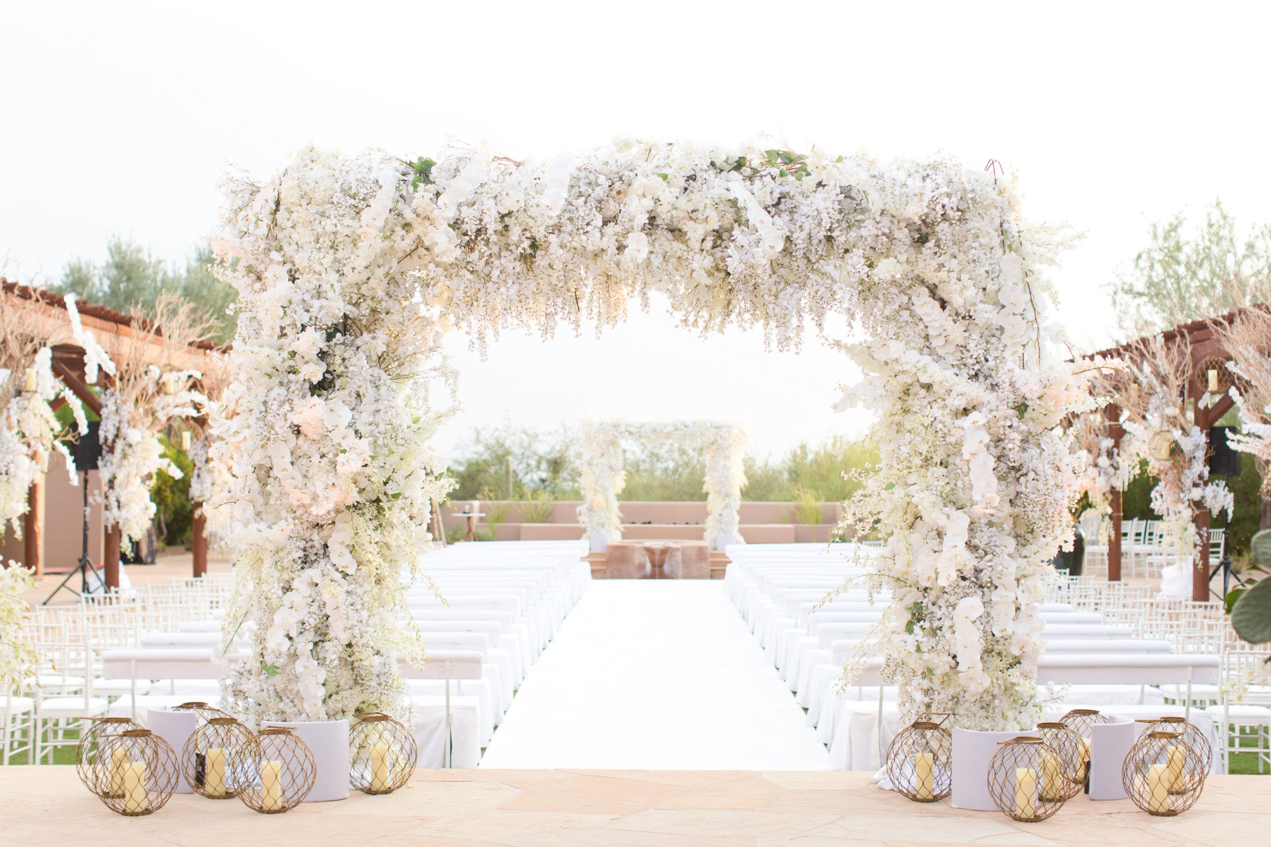 Stunning White Outdoor Wedding in Scottsdale With White Florals and Arches | PartySlate
