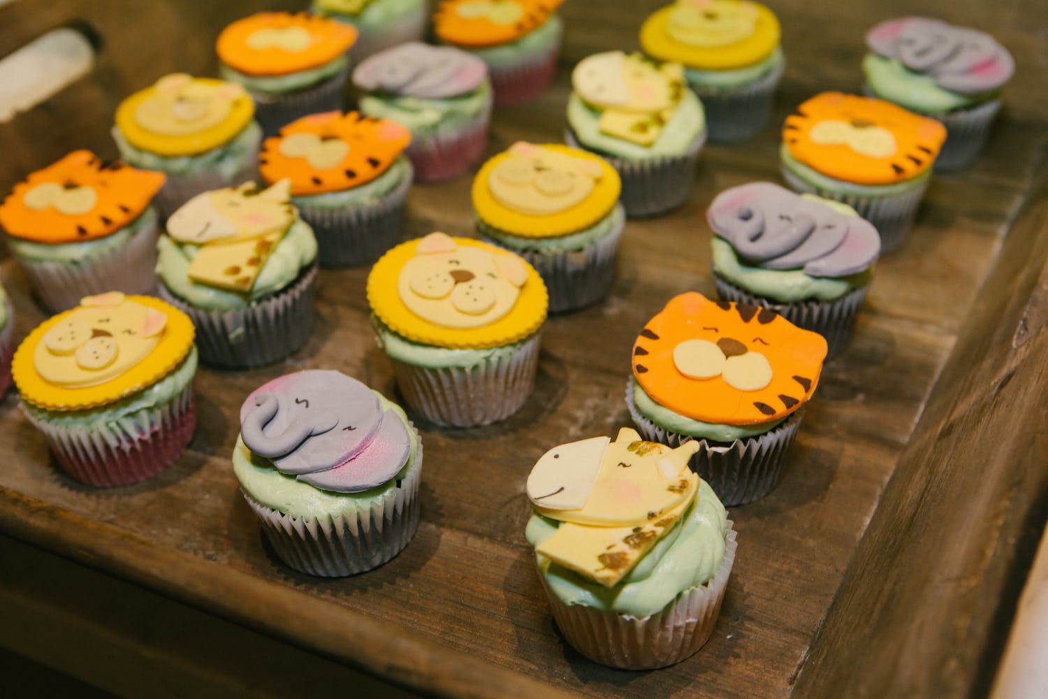 Animal cupcakes for safari baby shower theme | PartySlate