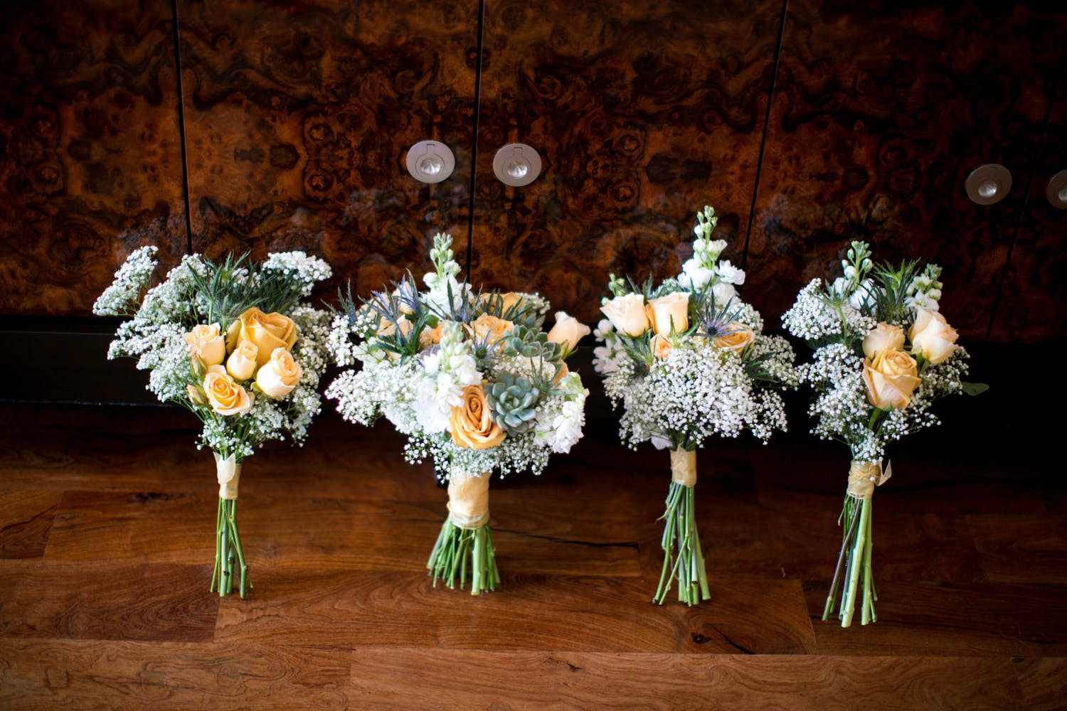 Bouquets in apricot, white, and blue | PartySlate