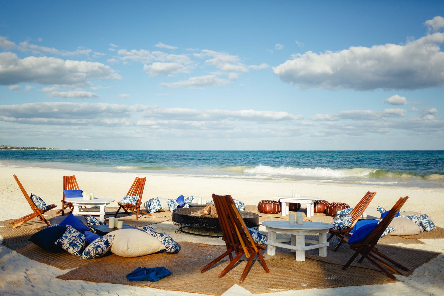 Beach wedding with blue boho lounge area | PartySlate