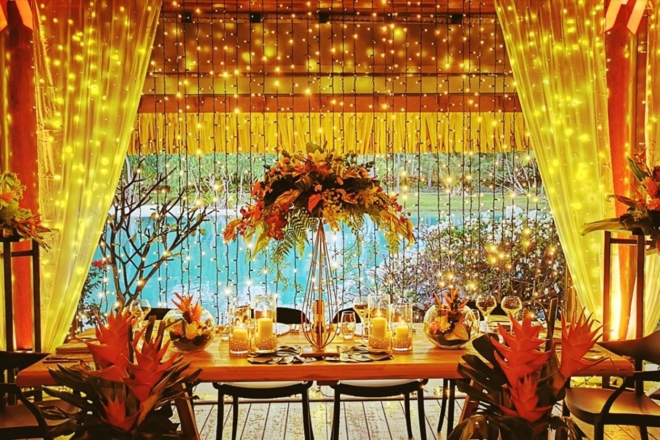 Wedding tent with gold lighting and string lights | PartySlate