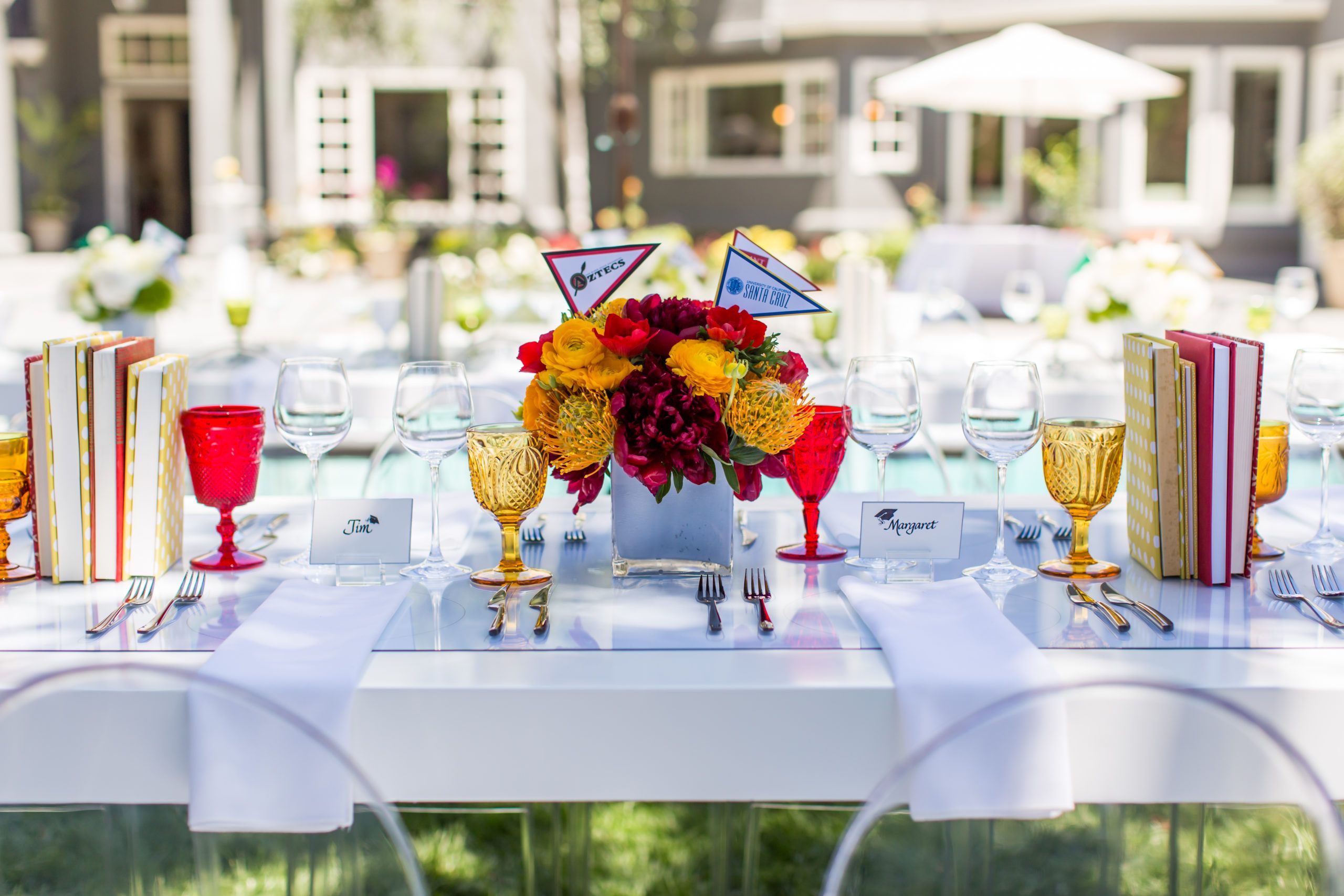 red and yellow graduation centerpiece on table | PartySlate