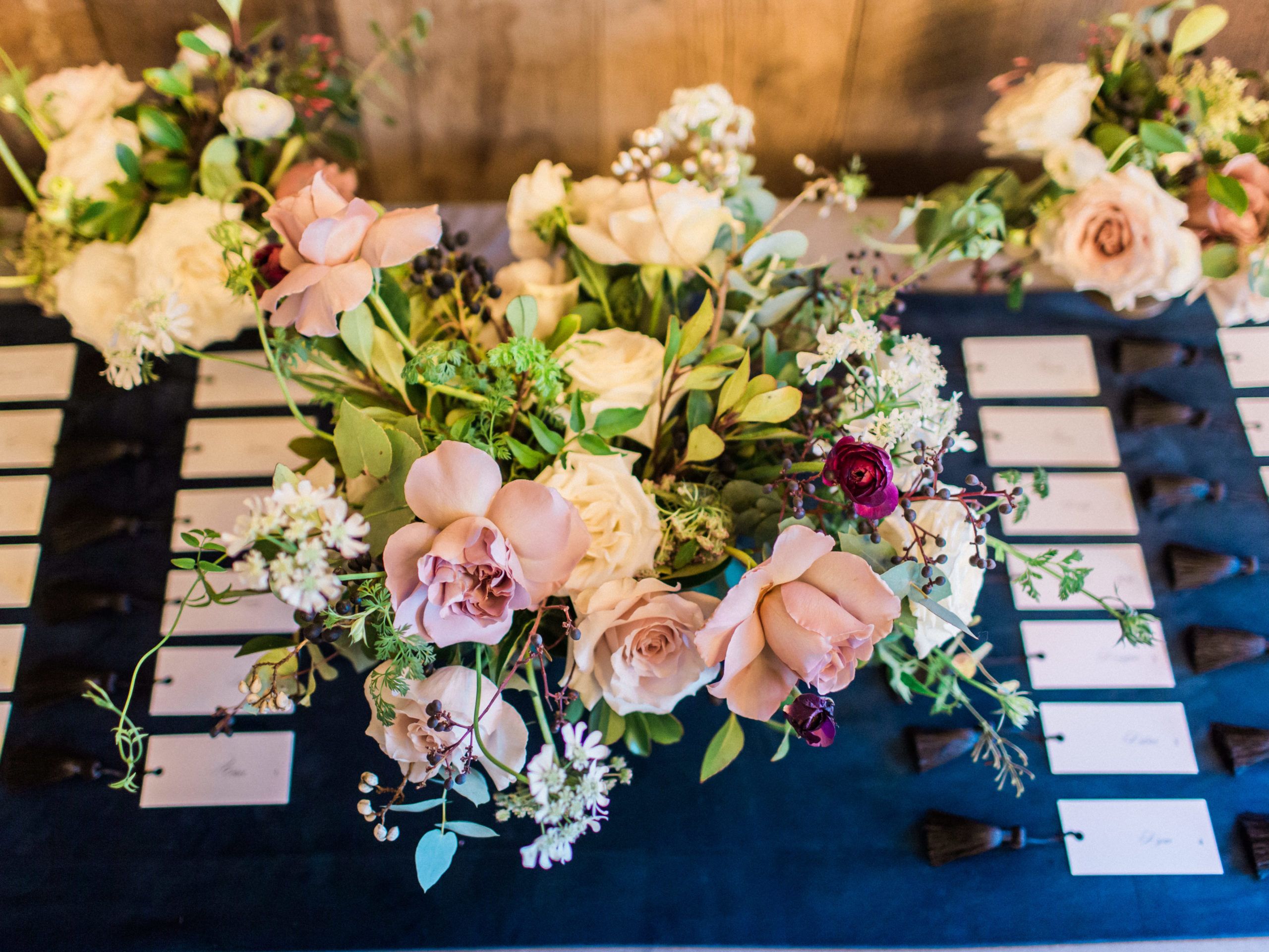 Navy Blue wedding color palette on table cloths and in floral arrangements | PartySlate