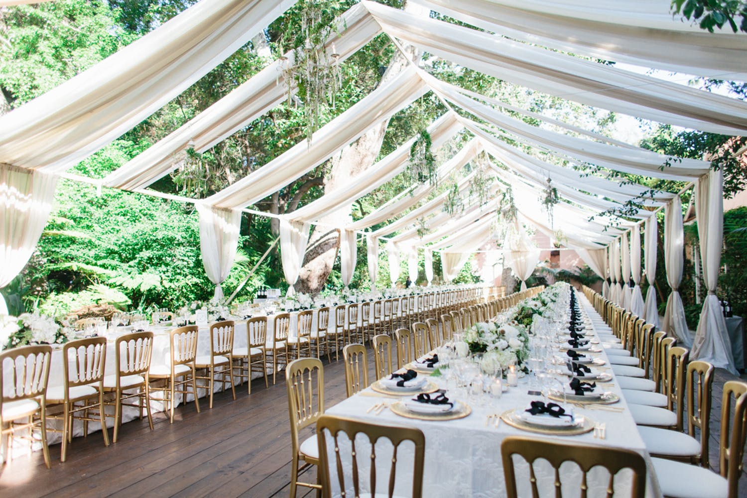 Open garden tent with white drapery | PartySlate