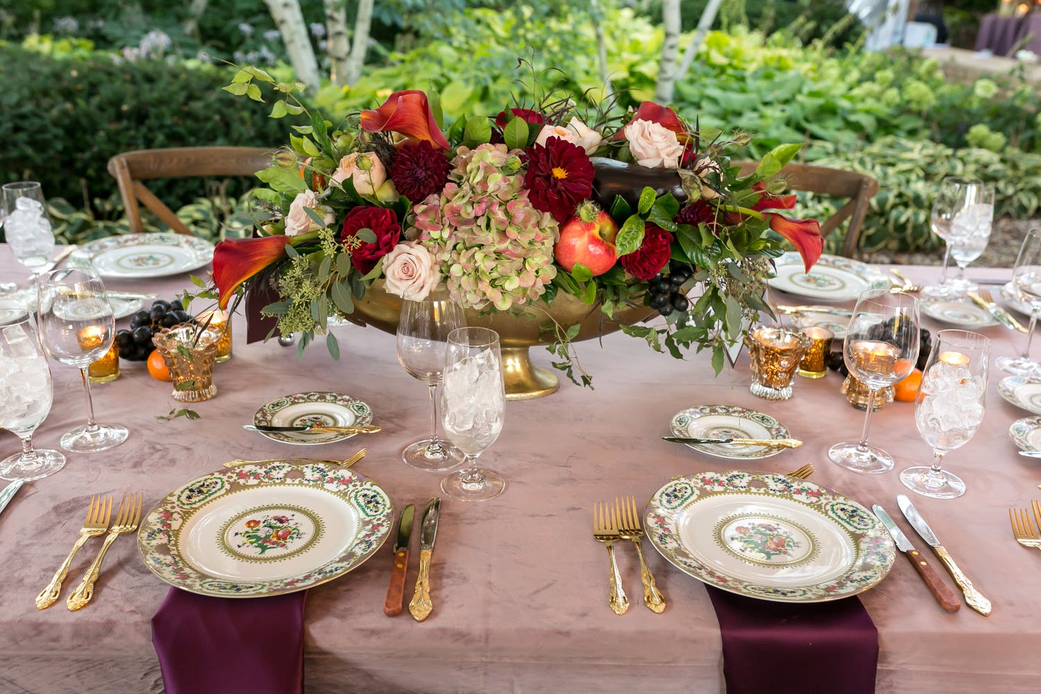 Garden wedding reception table with floral chinaware | PartySlate