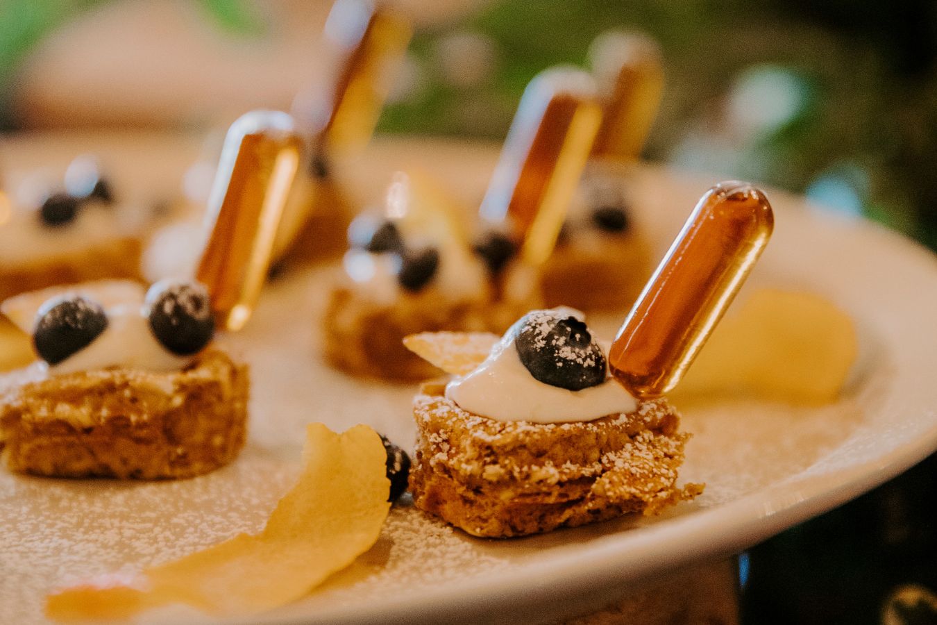 pancake bites with syrup syringe stuck inside | PartySlate