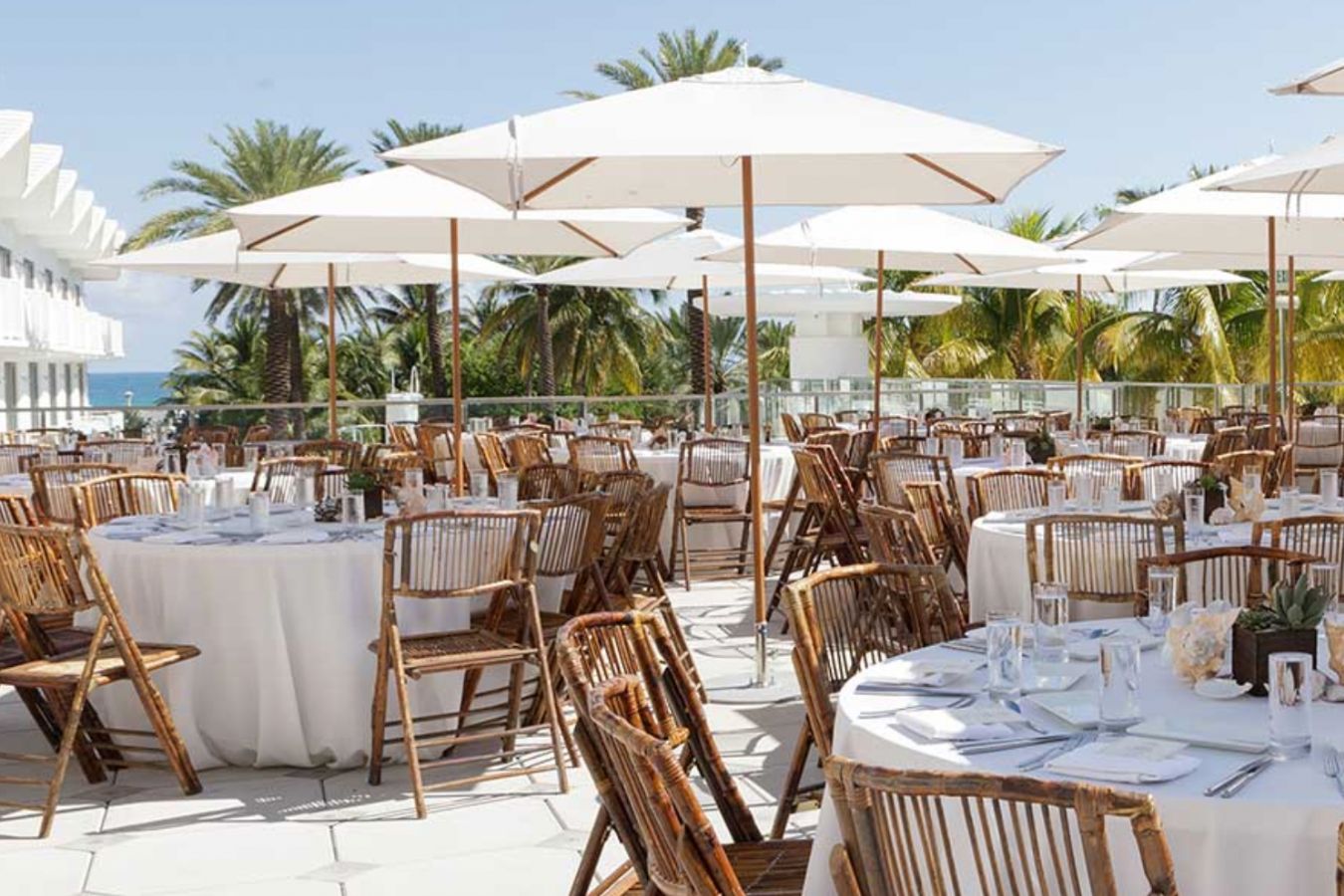 Shelborne South Beach rooftop terrace overlooking the ocean set up for a wedding reception | PartySlate