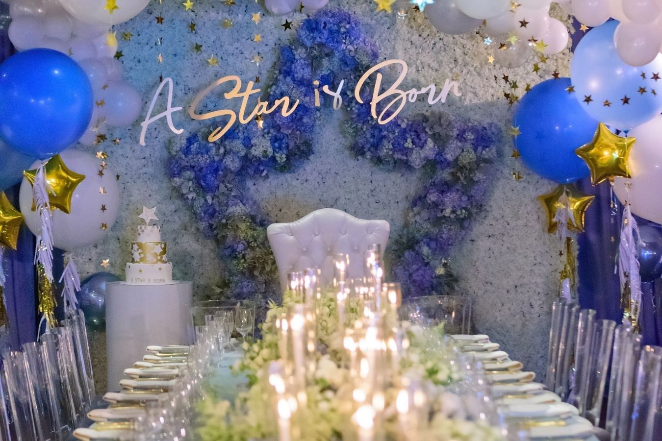 Celestial baby shower with candle light centerpieces and blue and white floral backdrop | PartySlate