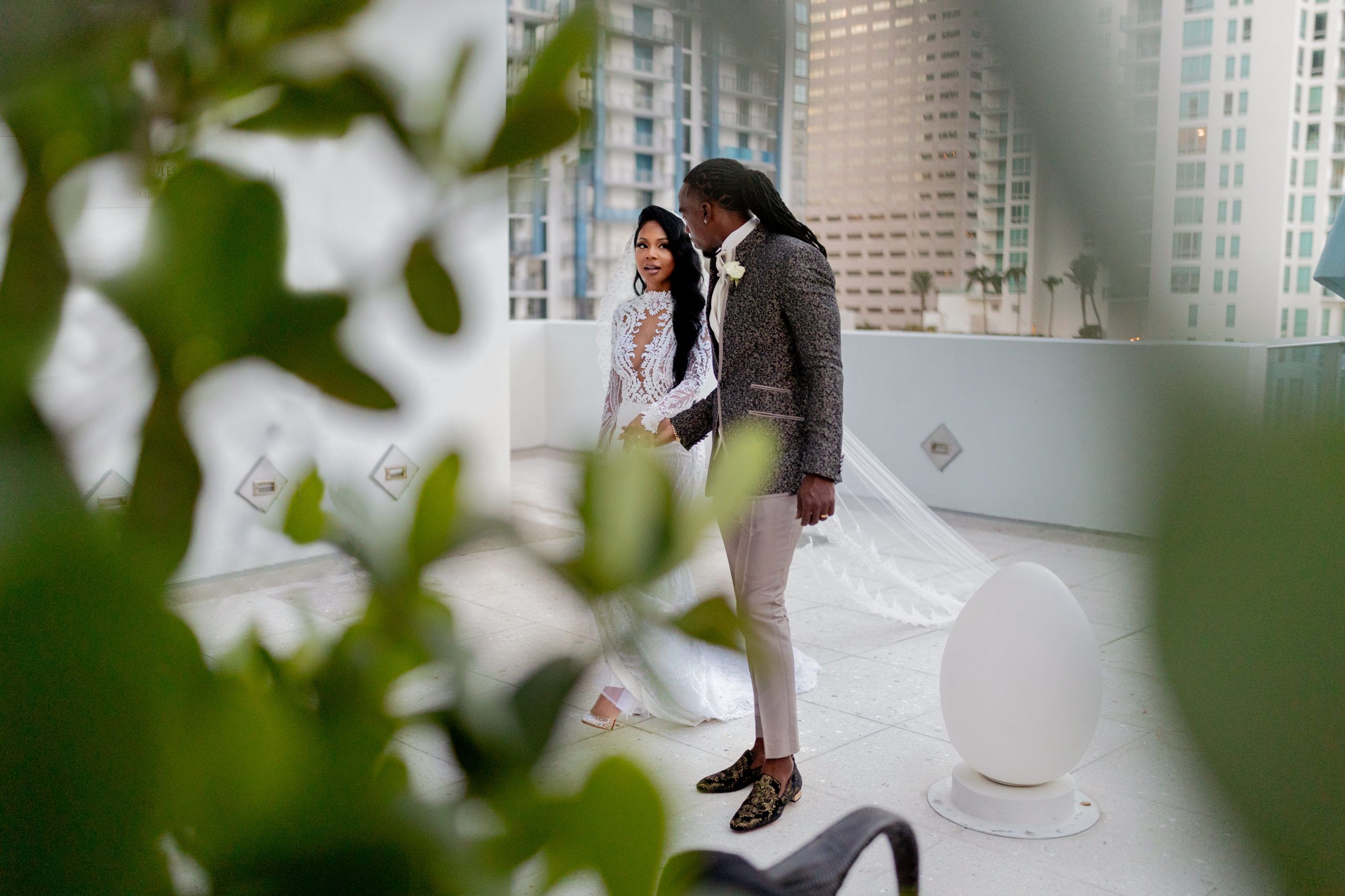 bride and groom on rooftop of miami wedding venues | PartySlate