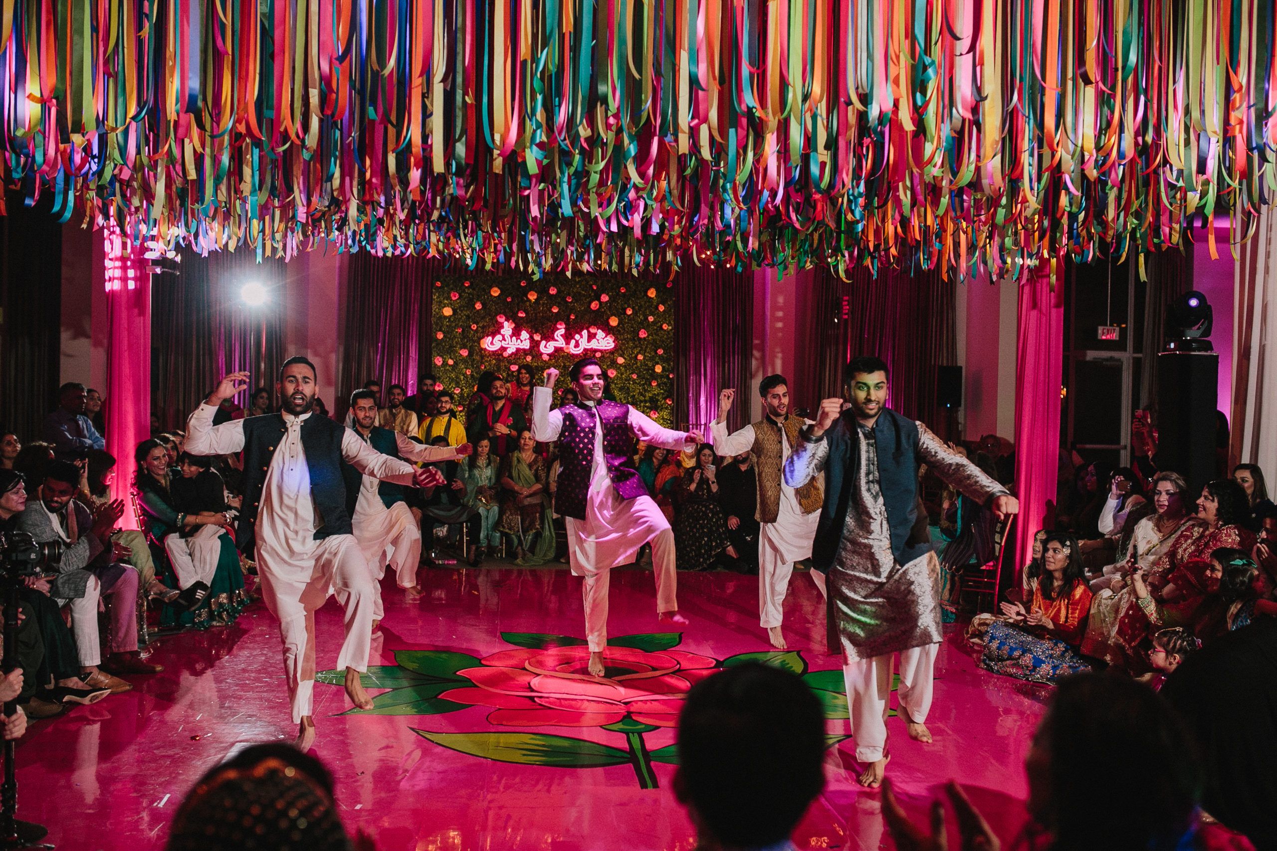Three men perform a choreographed dance at rainbow sangeet | PartySlate