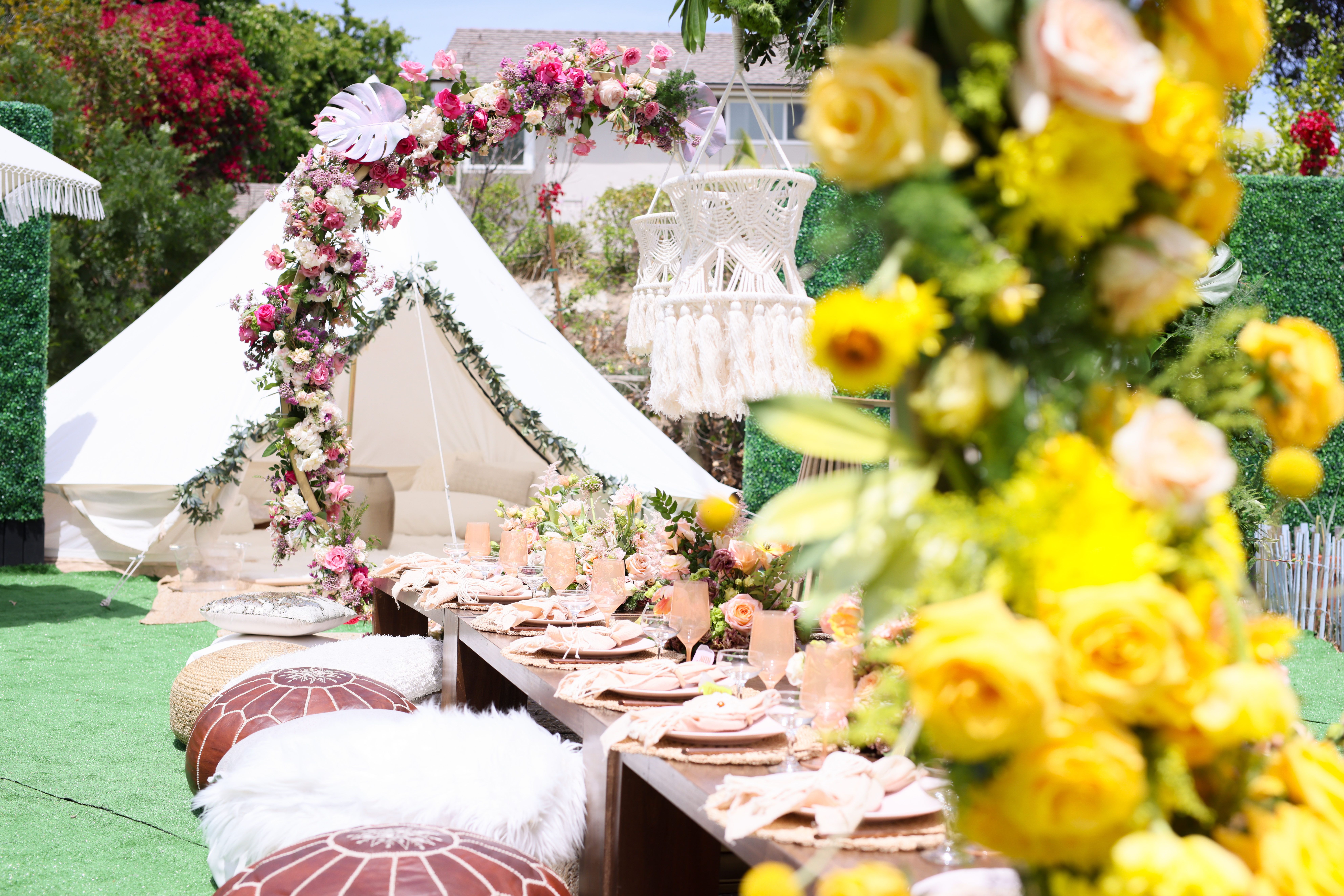 Boho baby shower with pink and yellow flowers | PartySlate