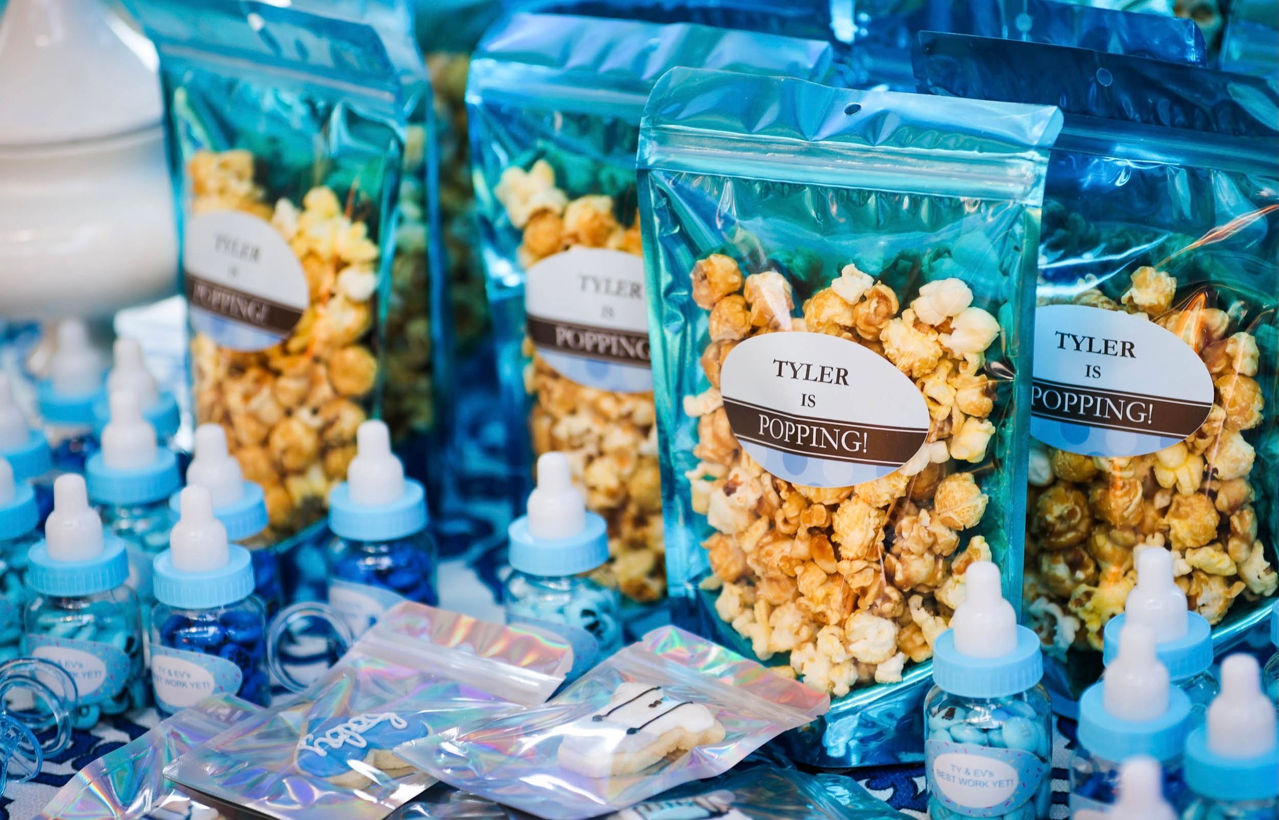 individually bagged caramel corn popcorn at baby shower in blue bags | PartySlate