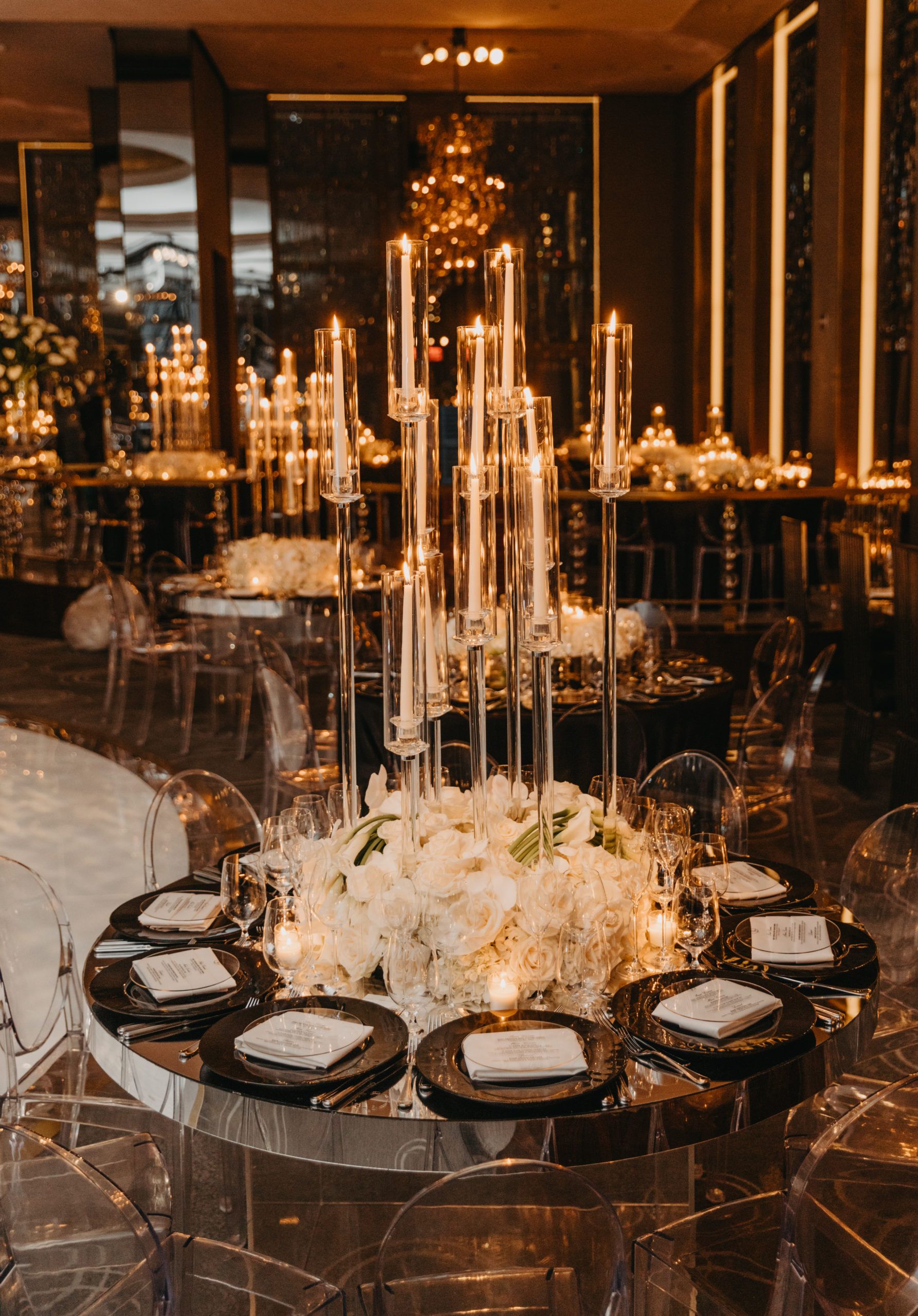 Dining table with candlelit centerpiece.