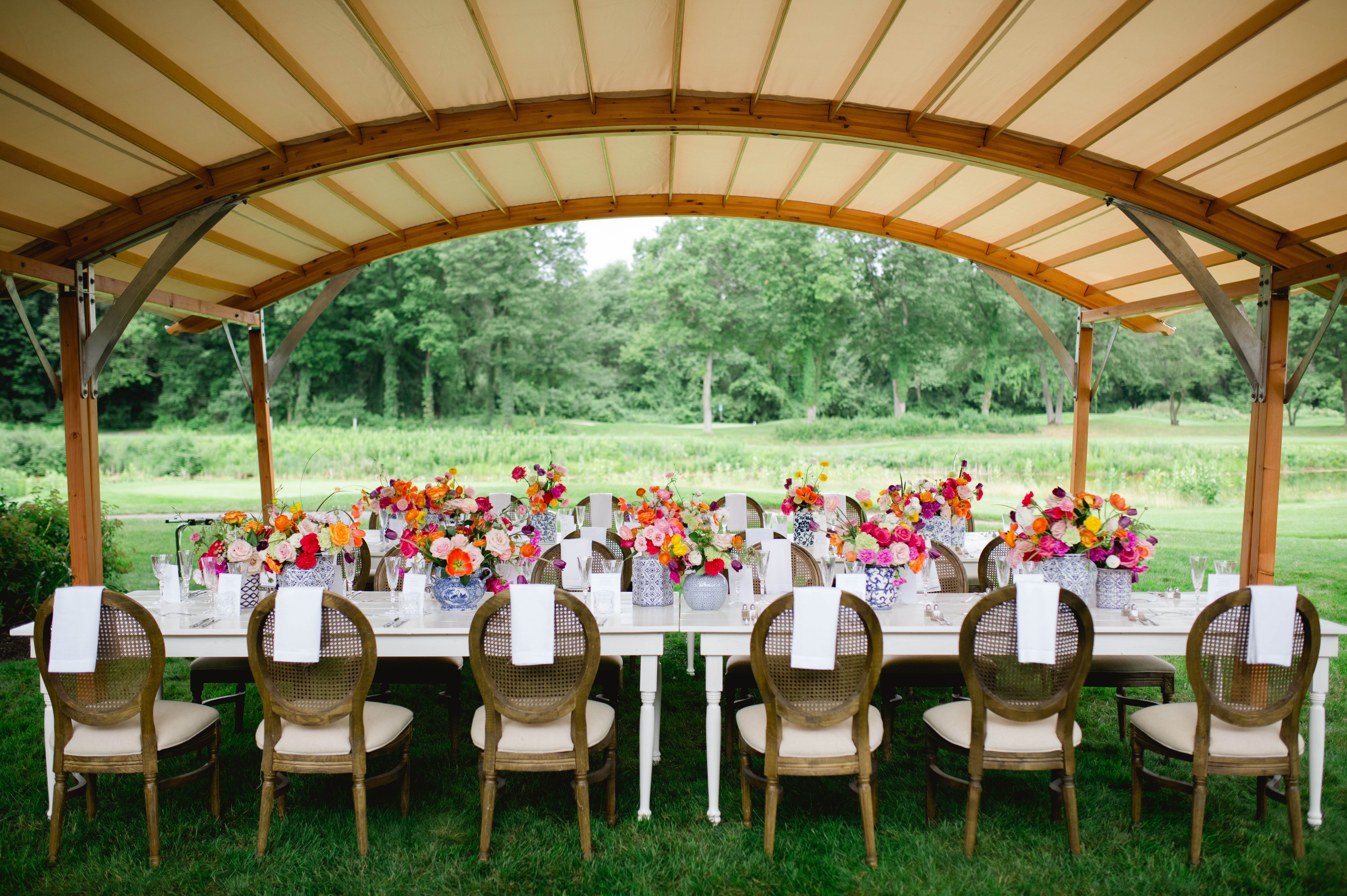 Outdoor summer baby shower with colorful table flowers | PartySlate