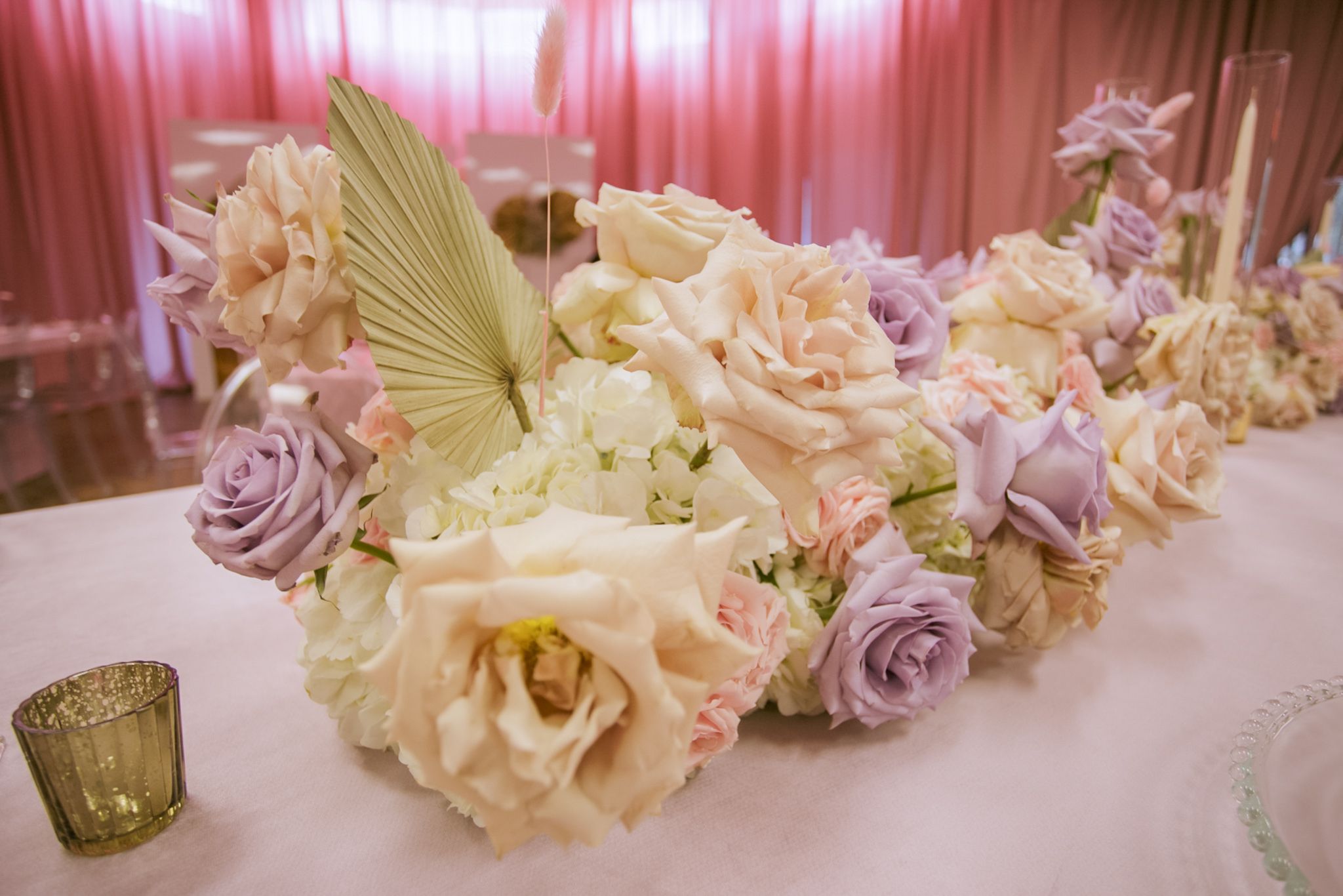 Pastel pink and purple rose centerpieces for baby shower | PartySlate