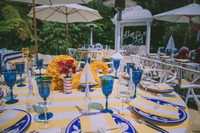 Nautical baby shower with yellow floral centerpiece | PartySlate