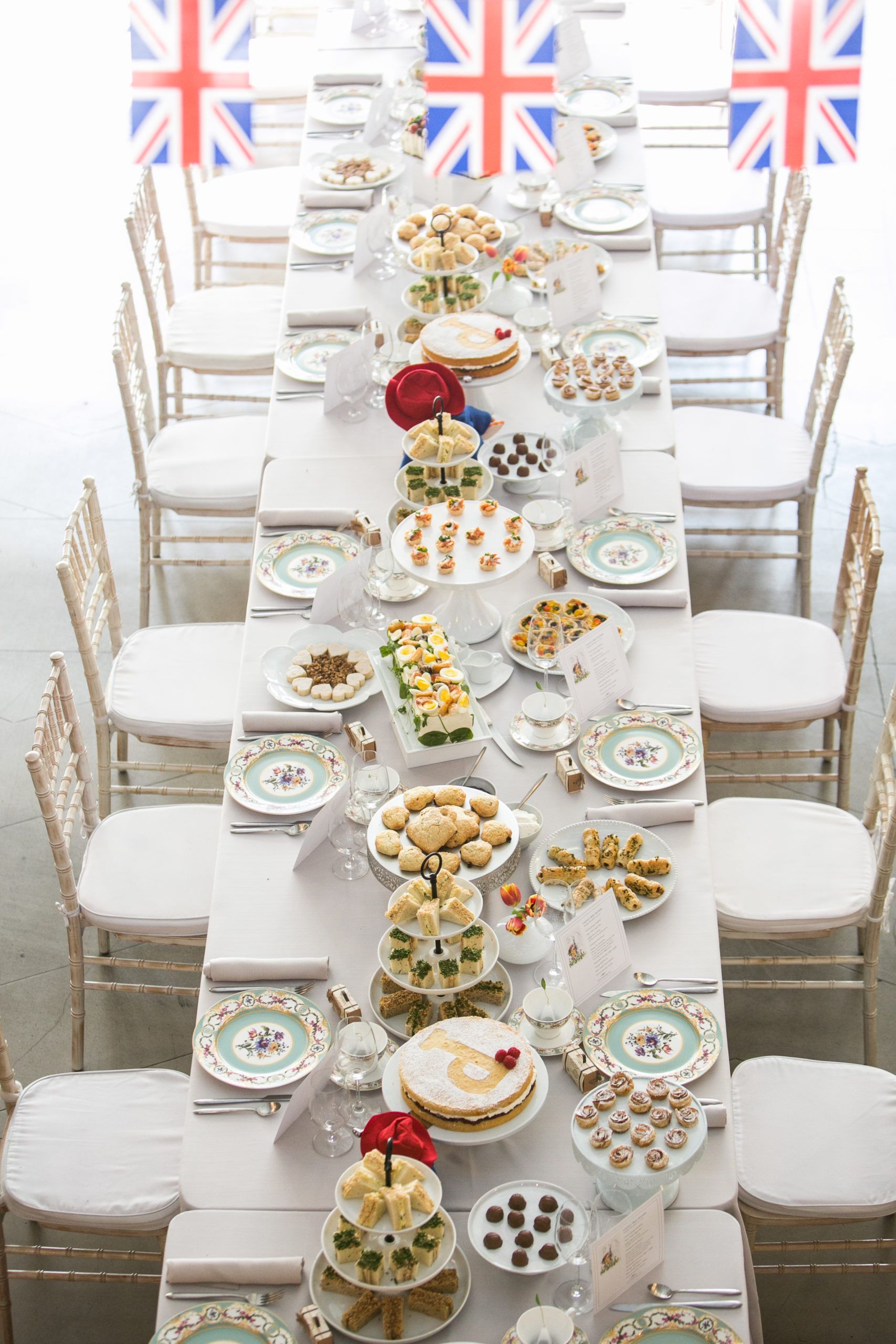 Paddington bear themed baby shower with food lining the dining table | PartySlate