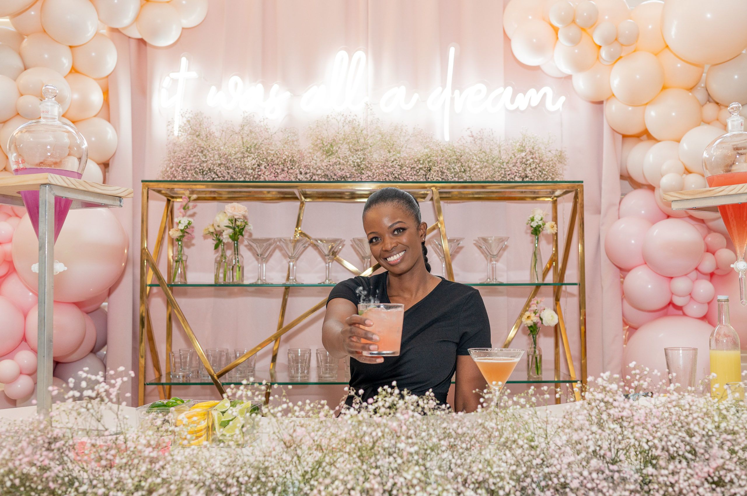 bar tender at baby shower handing out a cocktail | PartySlate