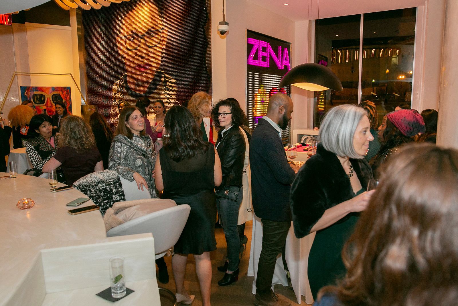 Reception and Art exhibit at hotel zena in d.c with guests talking in bar and lounge area | PartySlate