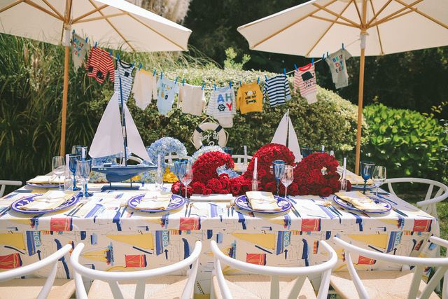 Nautical baby shower with red floral centerpiece | PartySlate