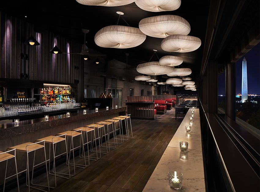 bar area and private dining in dc restaurant with mood lighting and barstools | PartySlate