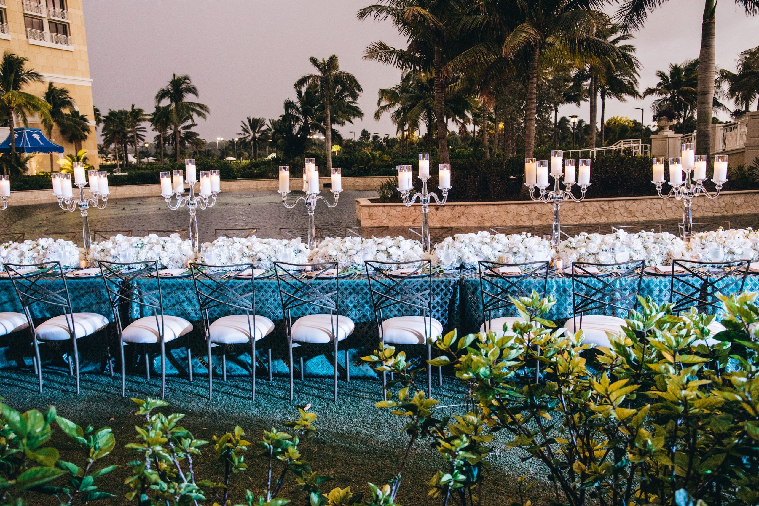 Al fresco wedding with blue linen and white florals | PartySlate
