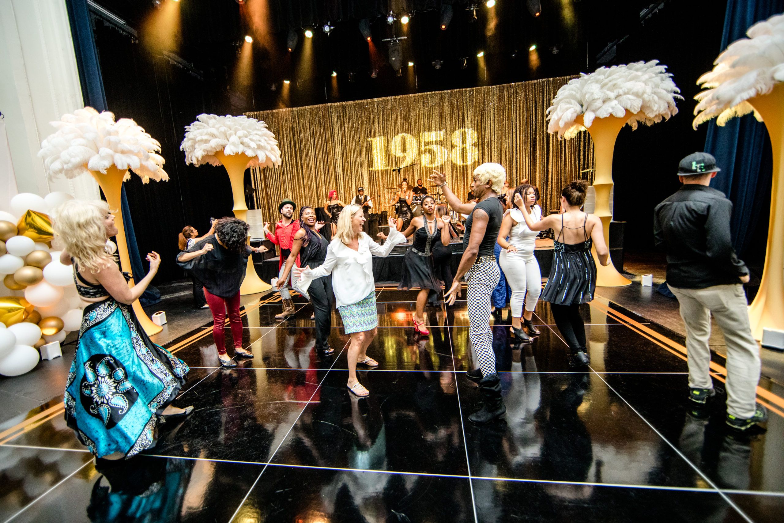 1958 themed 60th birthday party with gold accents | PartySlate