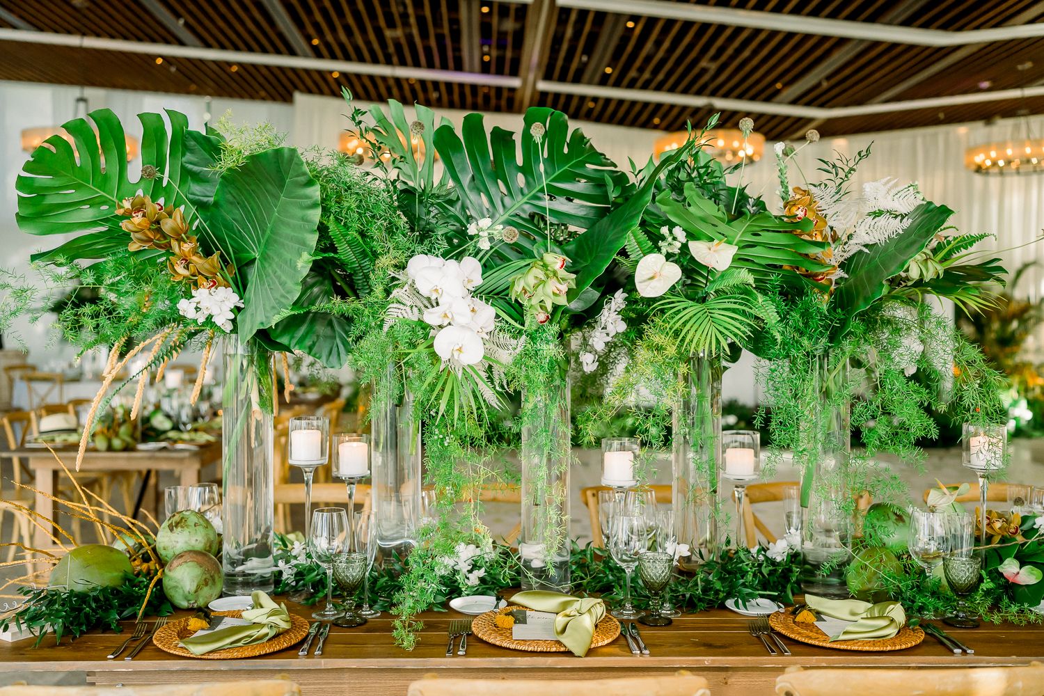 Tropical palm frond centerpieces for wedding | PartySlate