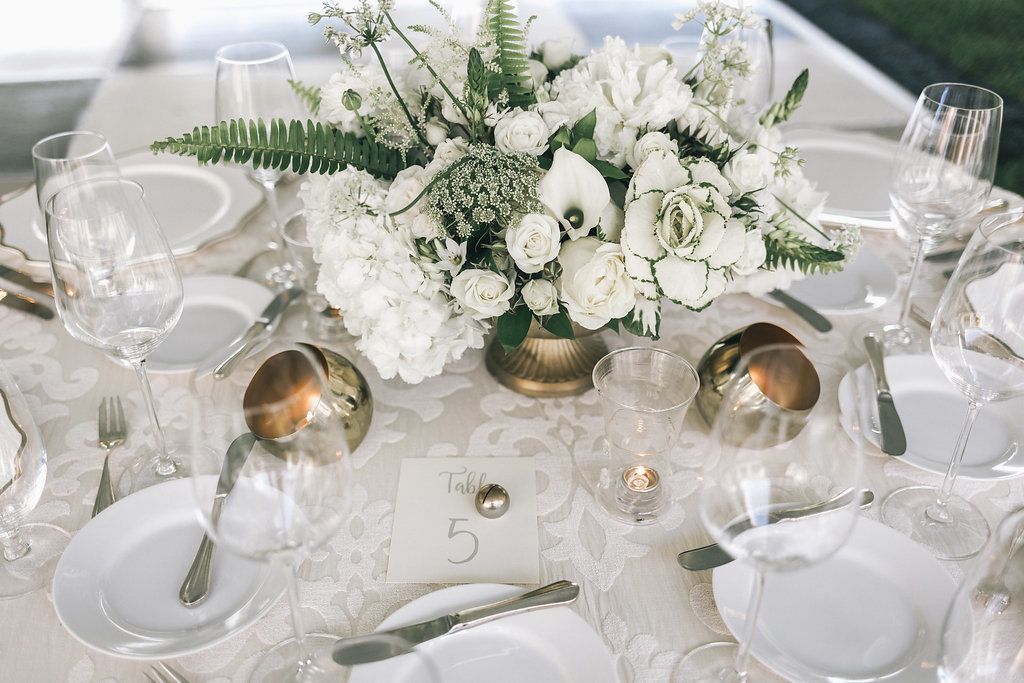 Summer wedding with white floral centerpiece | PartySlate