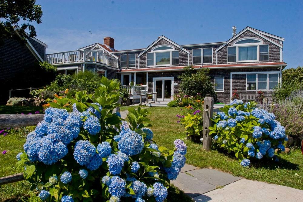 Outermost Inn Martha's Vineyard wedding venue with florals at entryway | PartySlate