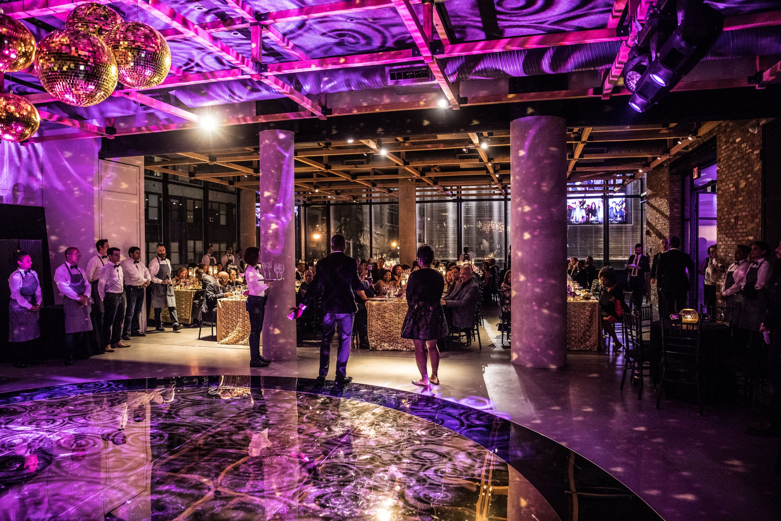 purple lighting on dance floor at 60th birthday party | PartySlate