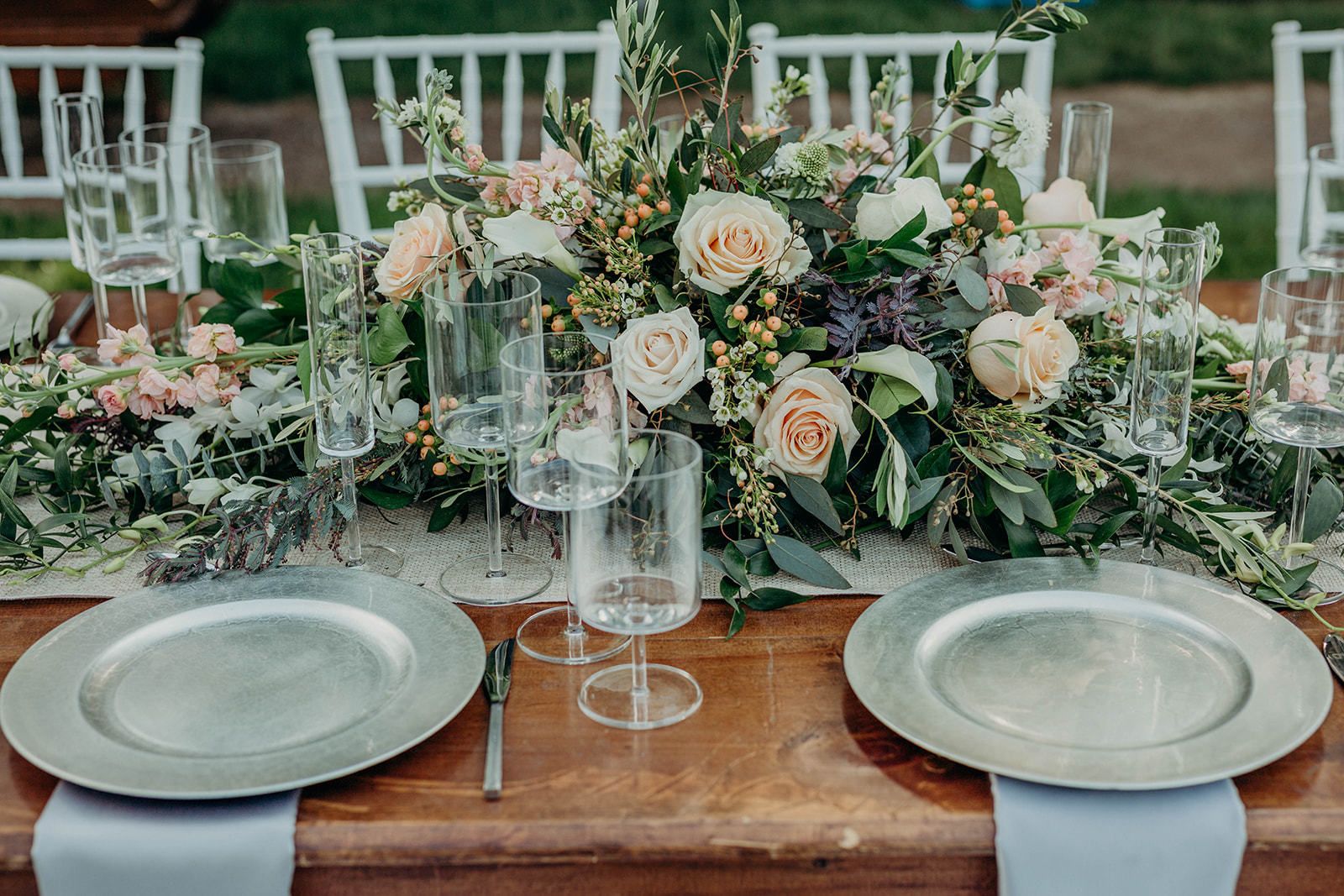 Summer wedding centerpiece with pink flowers and blue berries | PartySlate