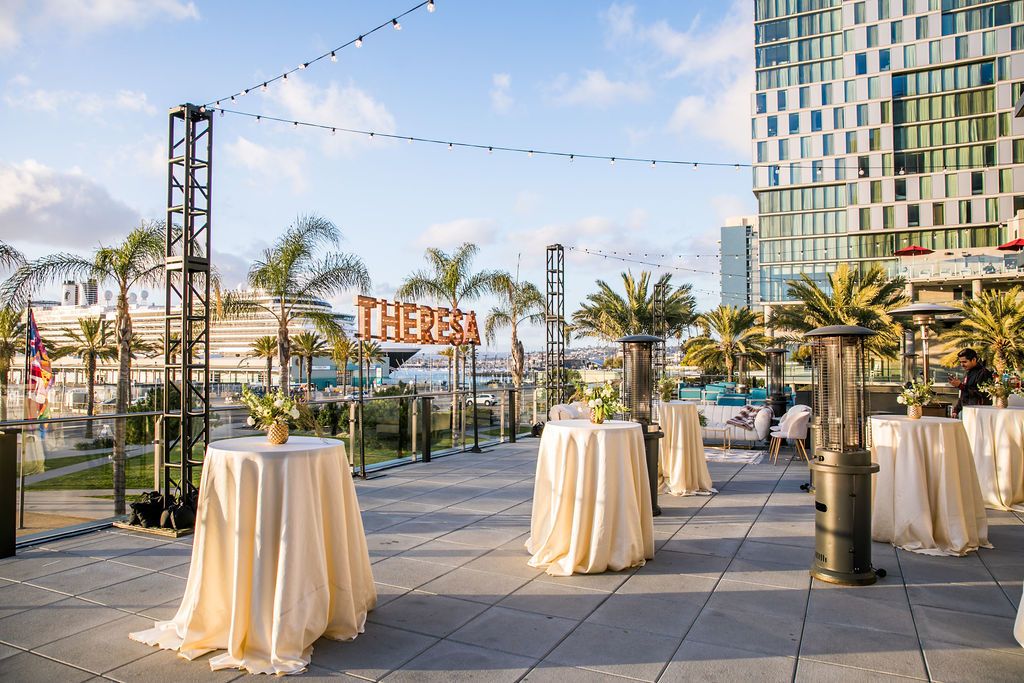 outdoor 60th birthday party with hanging marquee sign | PartySlate