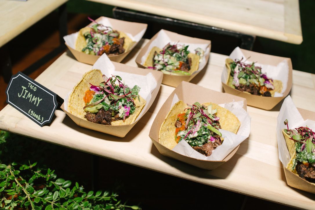 mini taco plates sitting on a platter at 60th birthday party | PartySlate