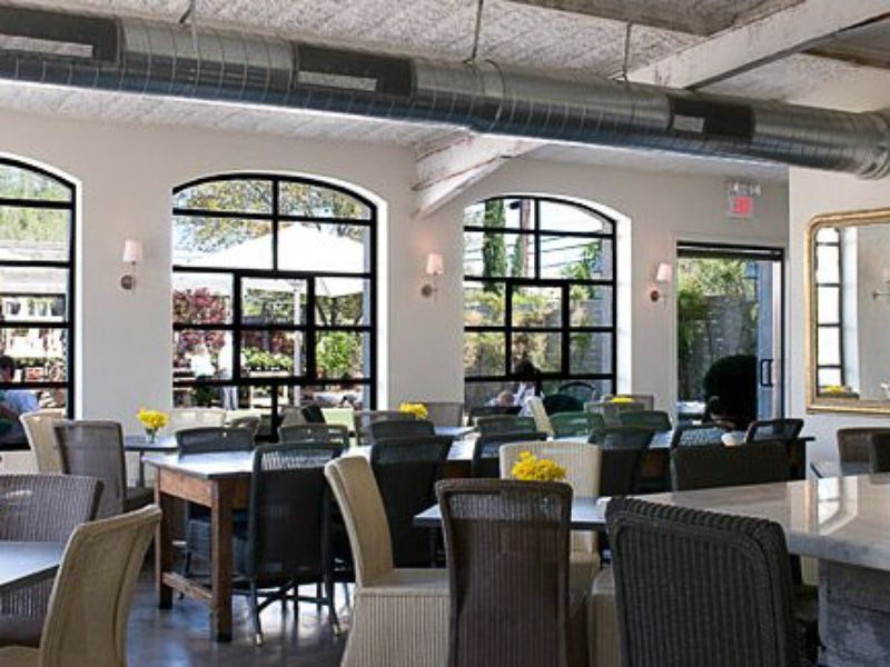 Tiny Boxwoods Houston interior restaurant with tables and chairs | PartySlate