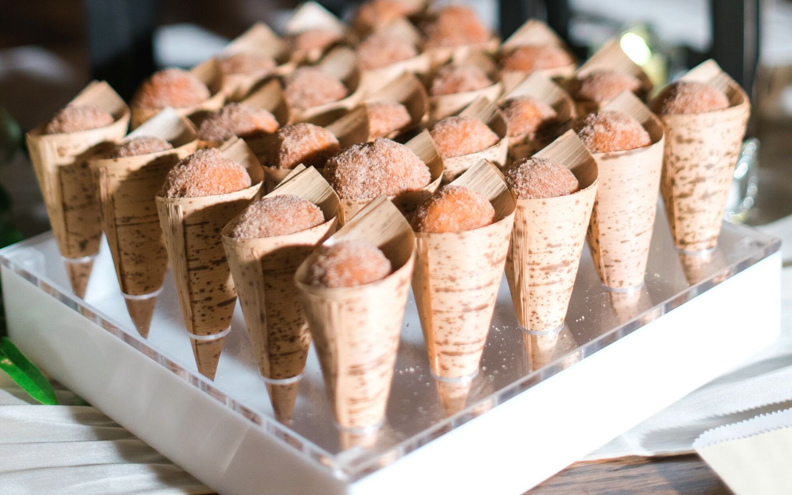 Cones filled with sugar donuts.