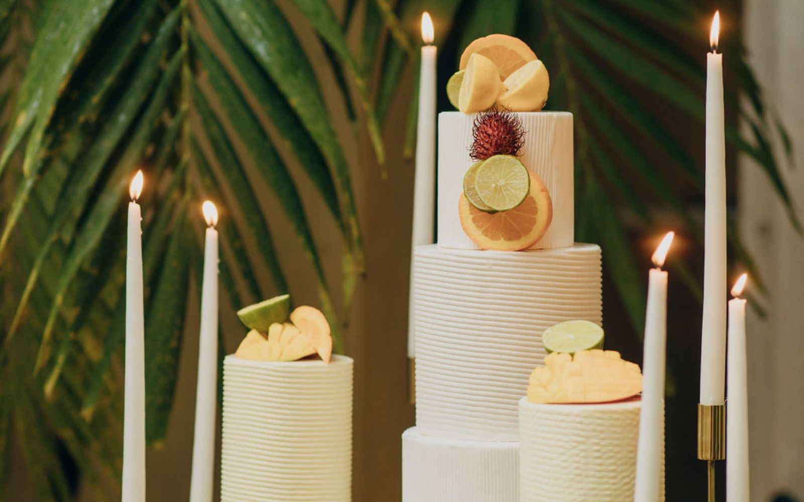 White cake with citrus fruit slices as toppings.