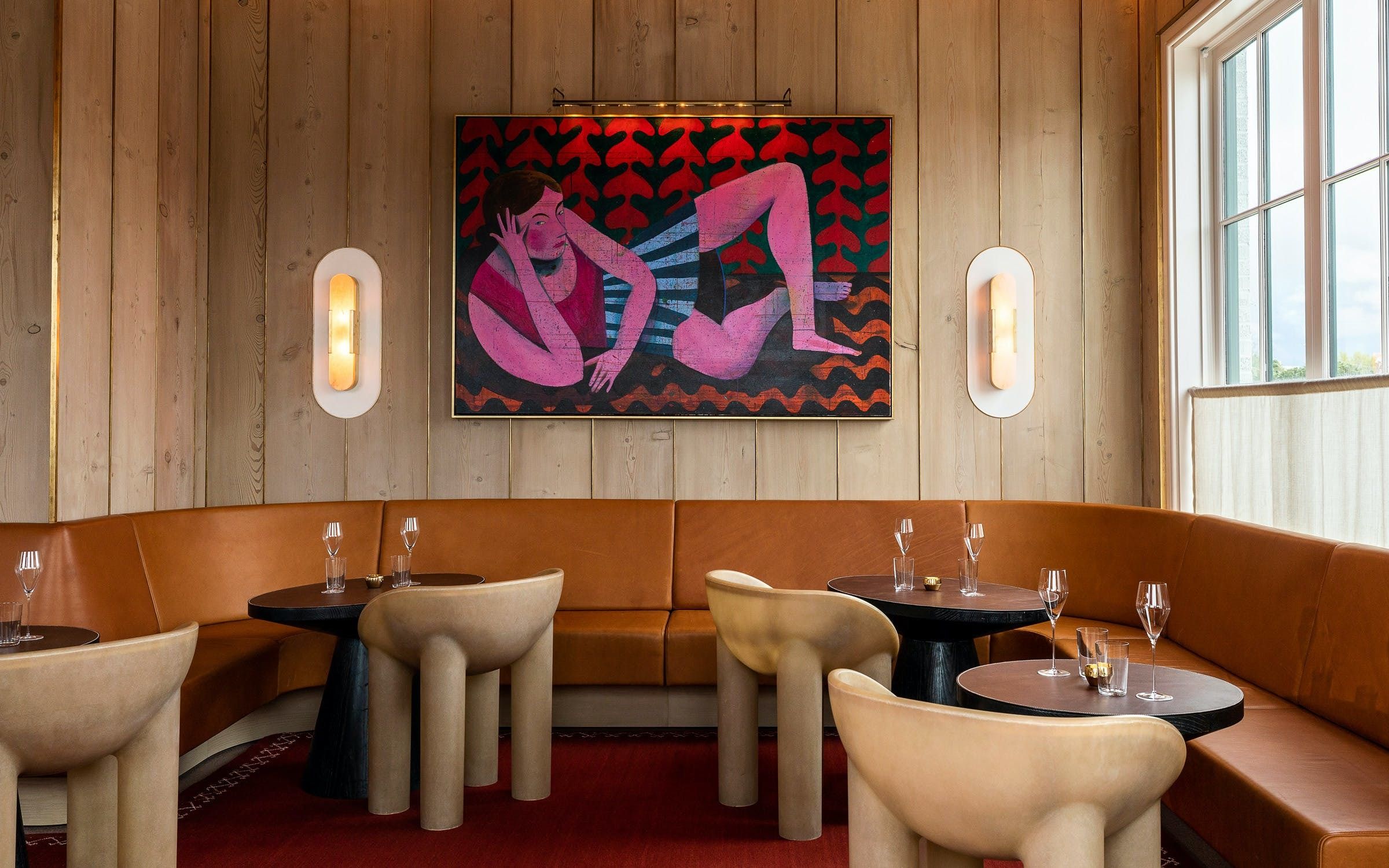 interior dining room of March Houston with artwork on the wall and booth seating | PartySlate