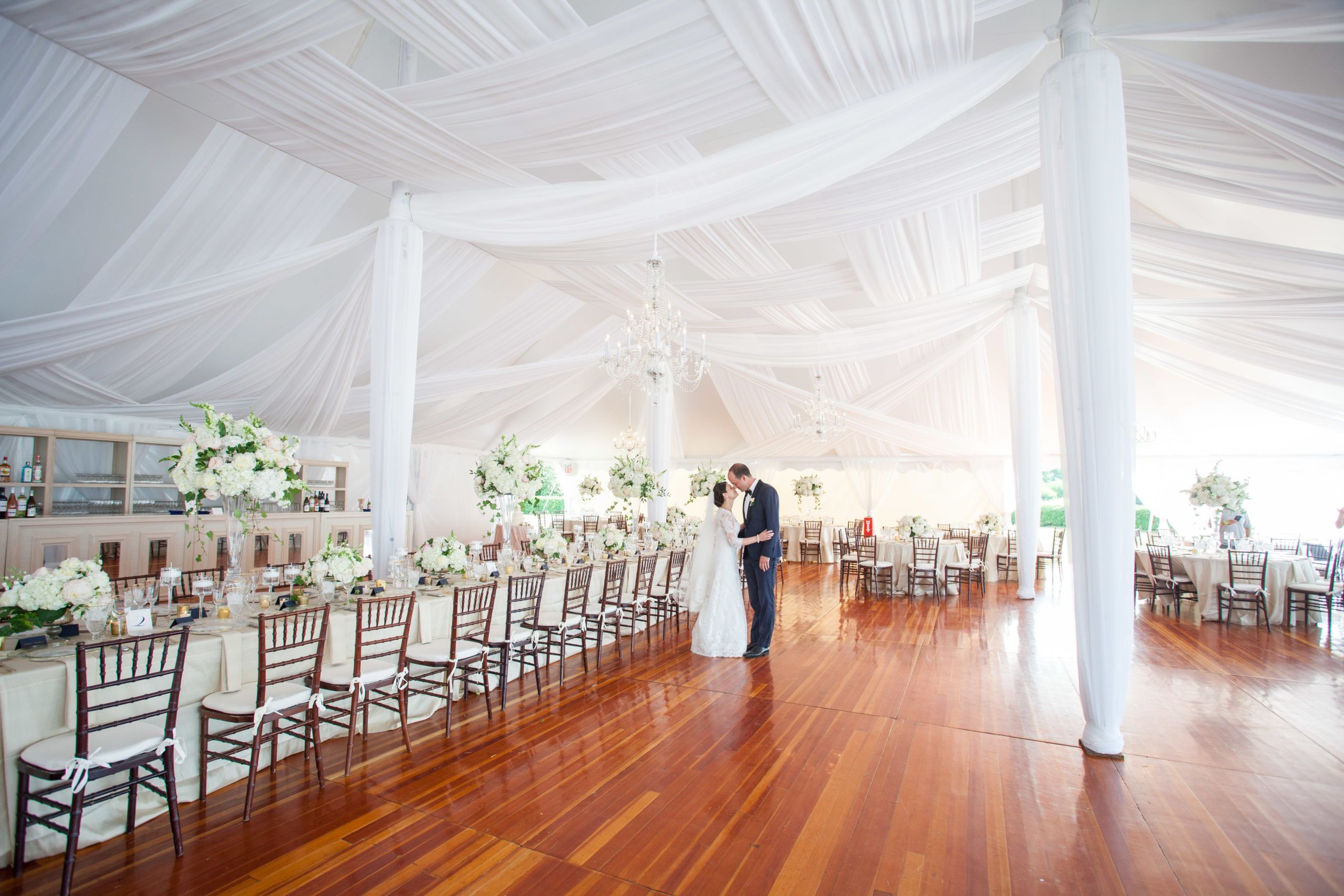 Classic Nautical Newport Summer Wedding at Eisenhower House with white tent with drapery | PartySlate