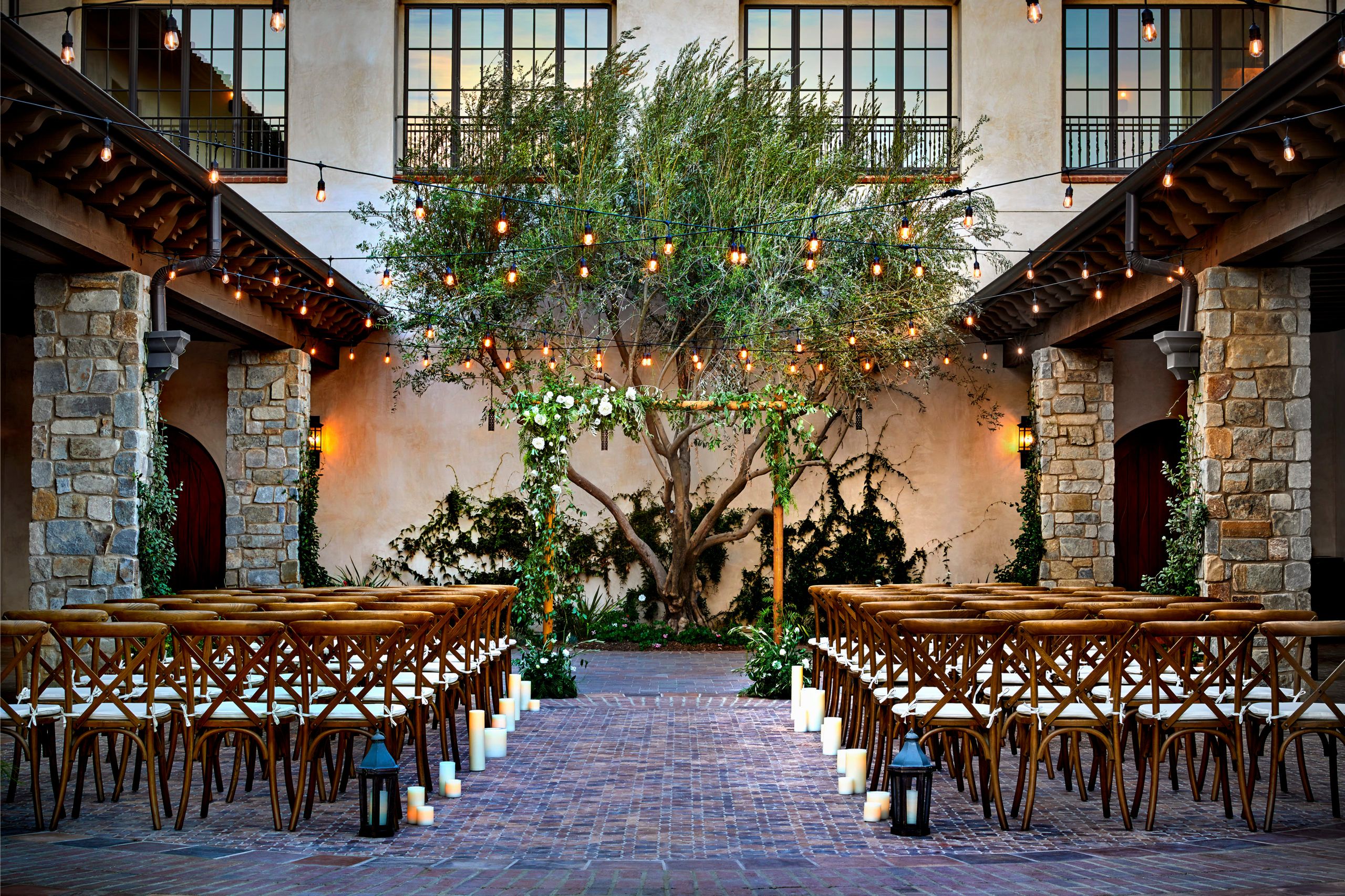 courtyard area at Inn at the Mission, San Juan Capistrano, Autograph Collection with twinkle lights | PartySlate