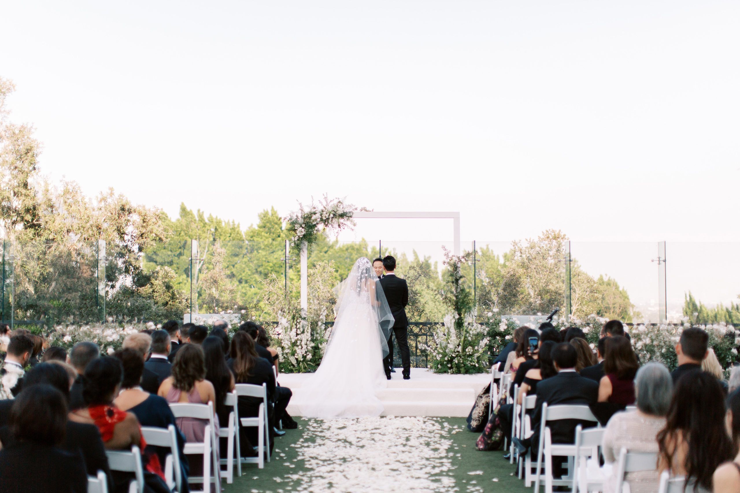 Stunning Rooftop Wedding at the London West Hollywood, California with pink florals | PartySlate